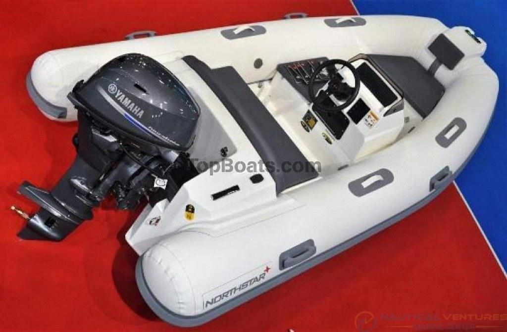 2022 Northstar Axs 3.1 inflatable boat with Yamaha outboard motor on display.