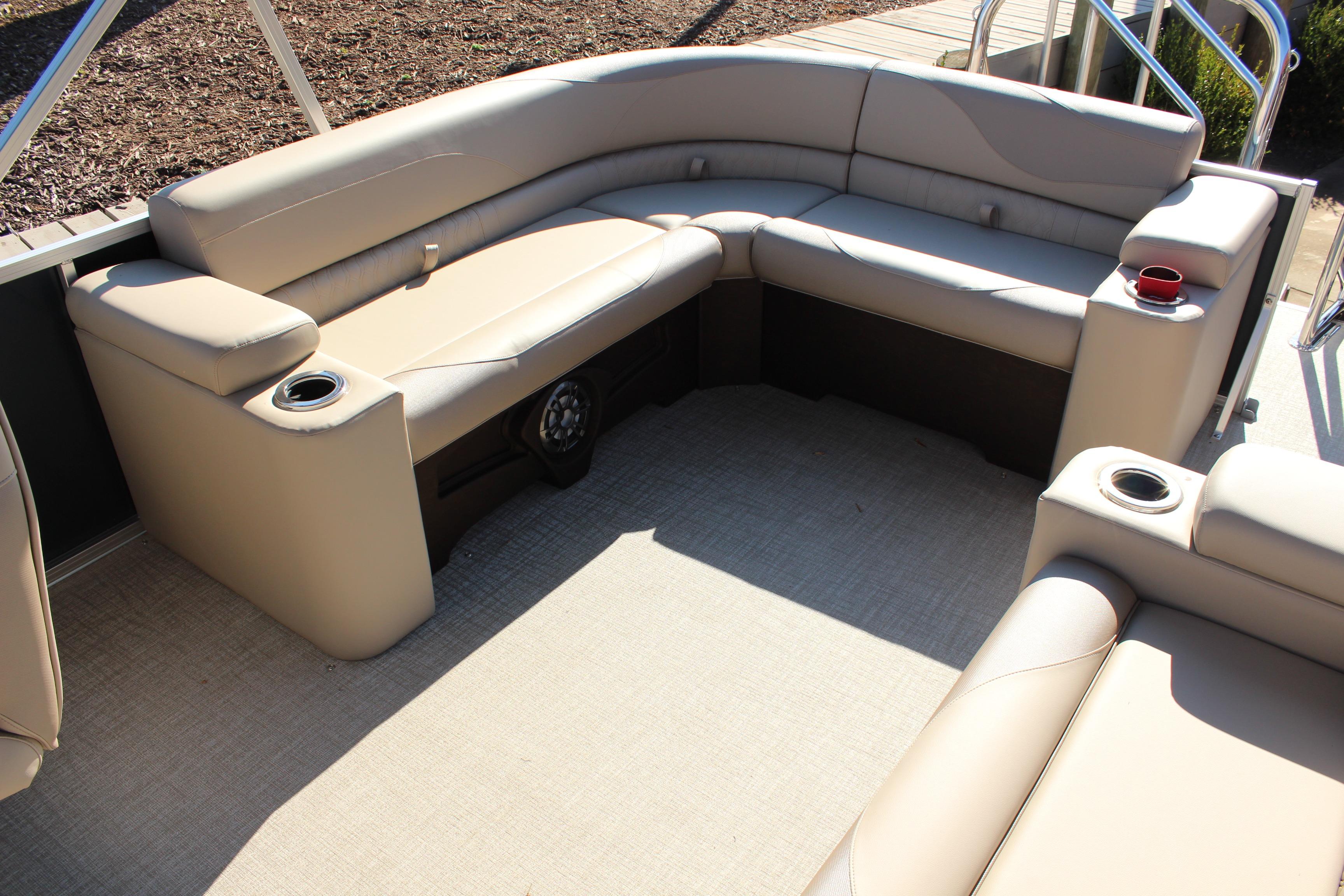 2026 Tahoe Pontoon LTZ Elite interior with beige seating and cup holders.