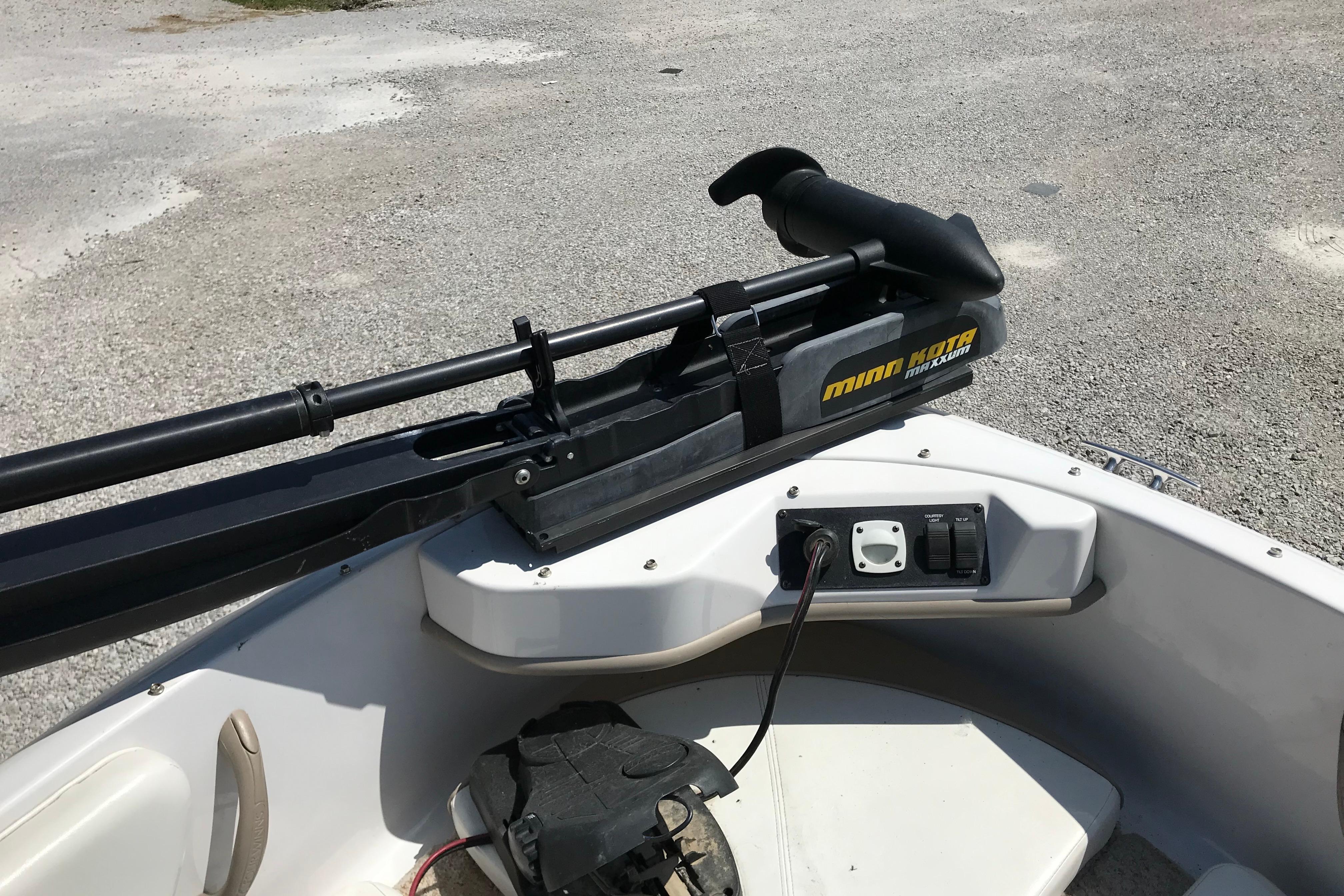 2005 Four Winns 180 Horizon FS boat with Minn Kota trolling motor on deck.