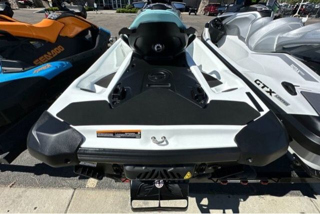 A 2026 Sea-Doo GTI 130 WH IBR 26 STD on a trailer, surrounded by other watercraft.