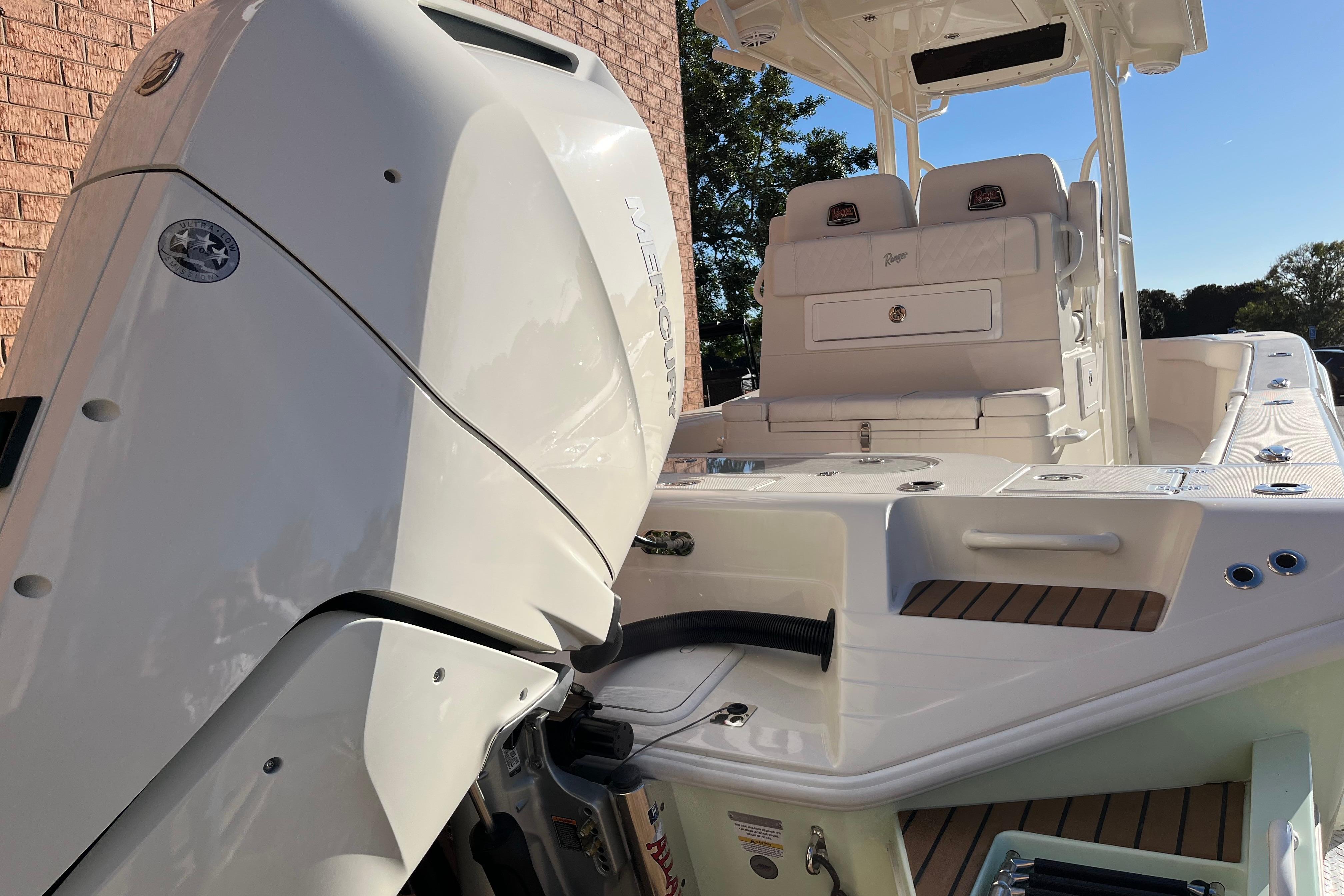 2024 Ranger 2600 Bay boat with powerful outboard motor, sleek design, and spacious seating.
