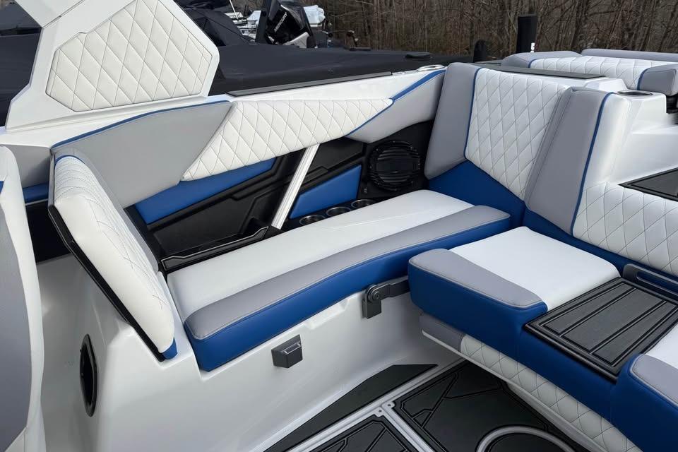 2026 Tigé Z3 boat interior with luxurious white and blue quilted seating.