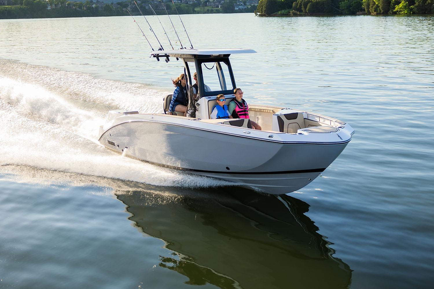 Manufacturer Provided Image: 2026 Yamaha Boats 255 FSH Sport H cruising on a serene lake.