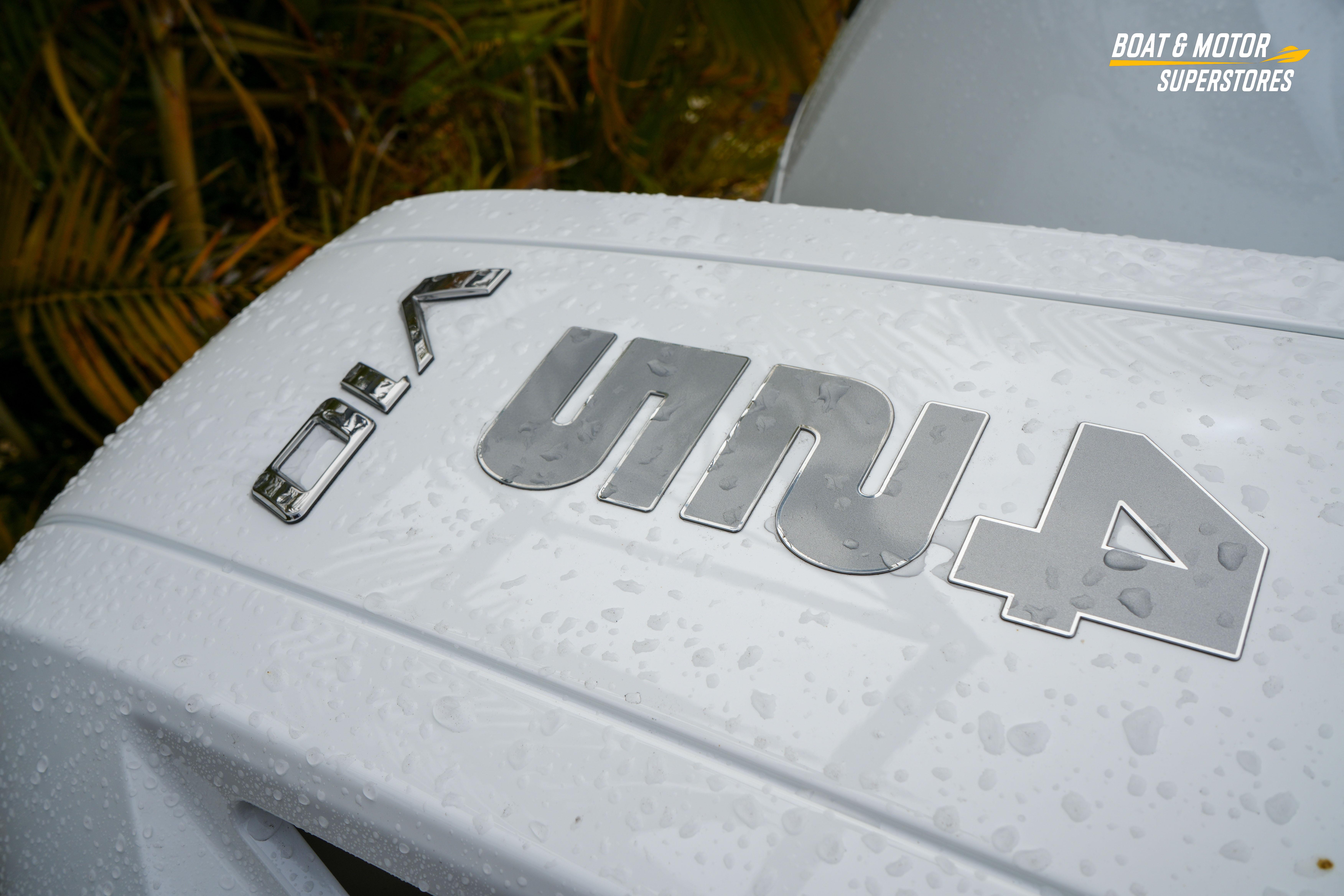 2026 Blackfin 332 CC boat with wet surface and logo detail.