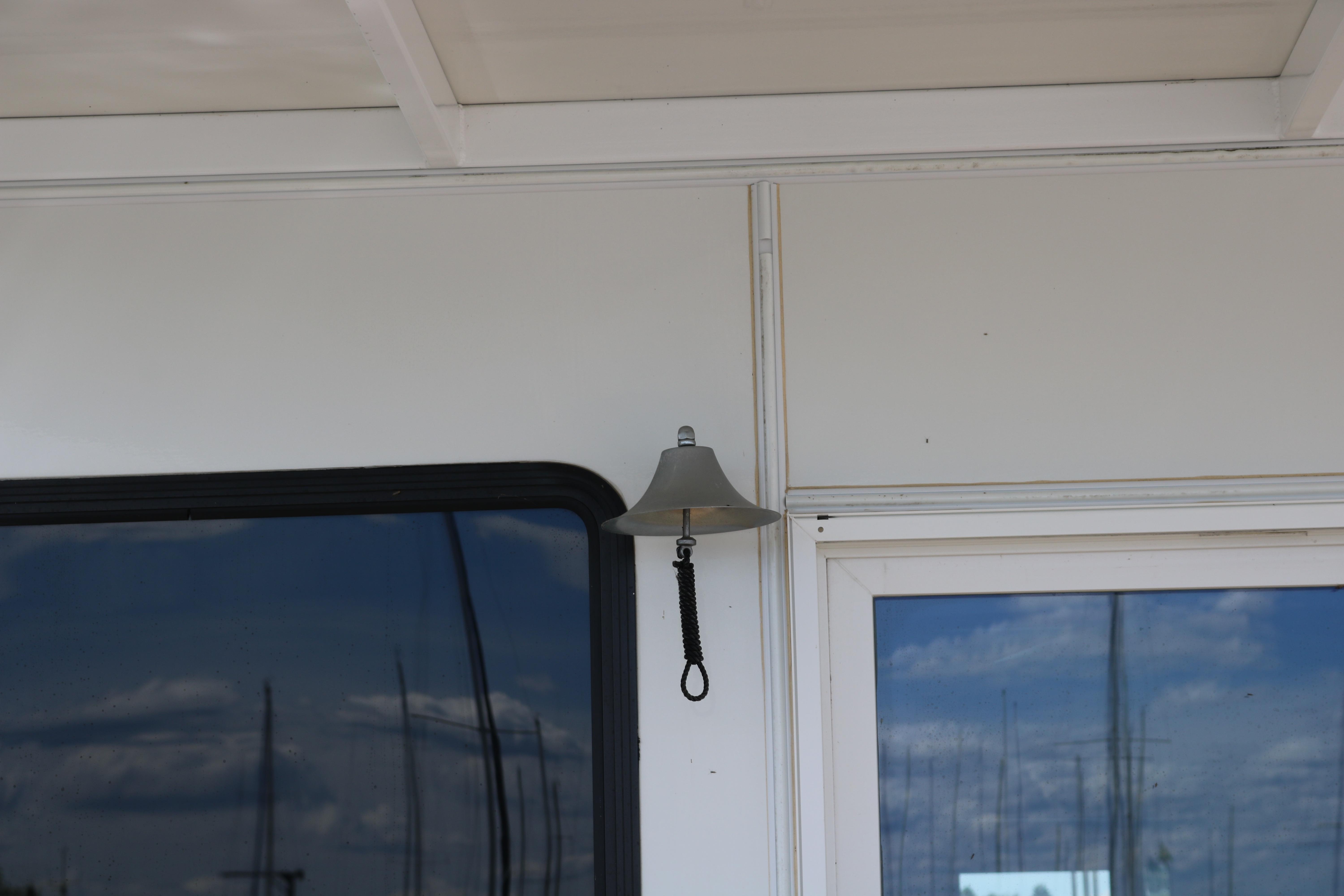 Bell on Skipperliner 480 Flybridge yacht, 2010 model, with window reflection.