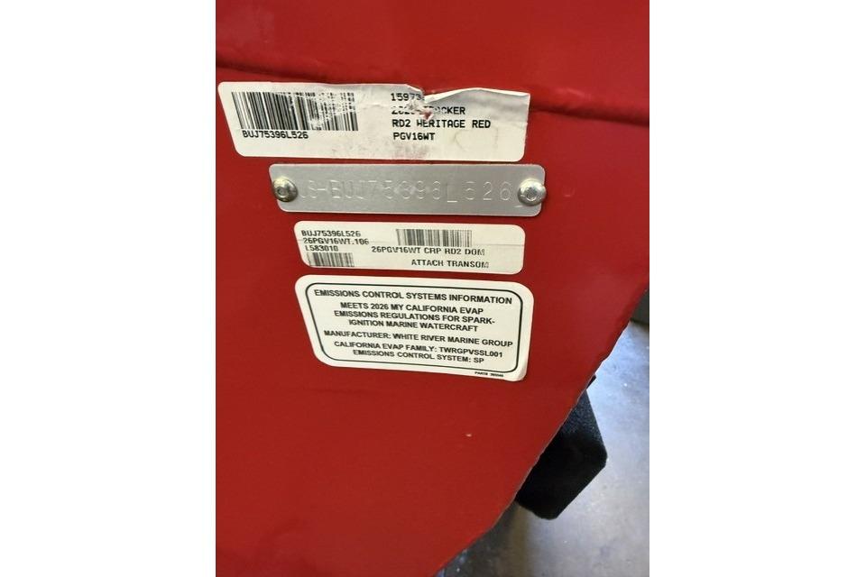 Red Tracker Pro Guide V-16 WT 2026 boat with emissions control information labels.