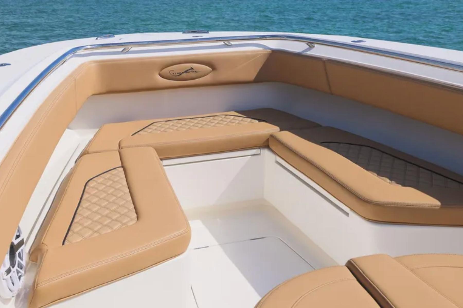 2025 Blackwater 41 Performance Fish boat interior with tan seating and ocean backdrop.