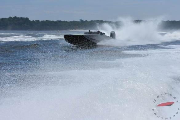 HellKats 320X 2021 speedboat racing on water, creating large splashes.