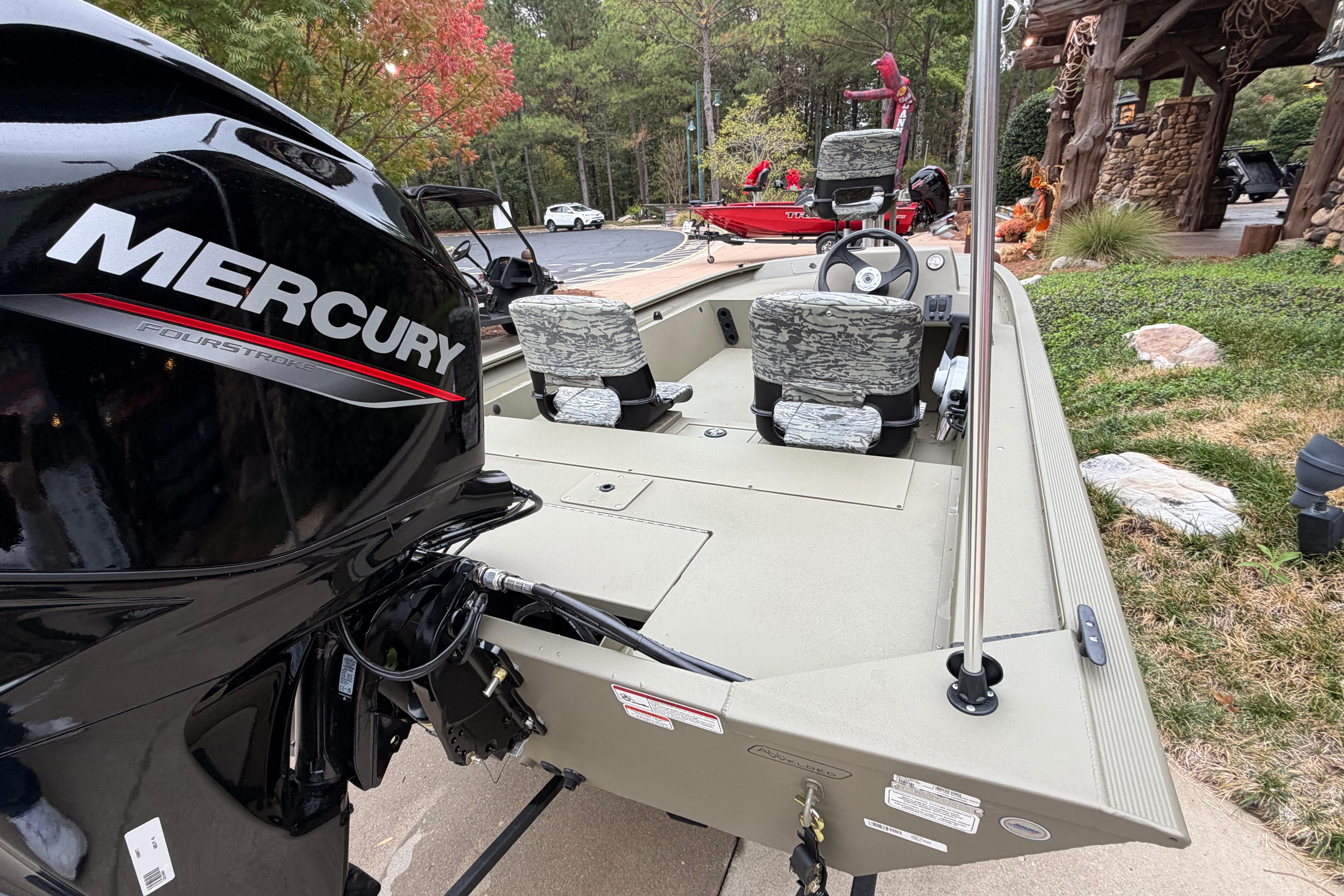 2026 Tracker Grizzly 1754 SC boat with Mercury FourStroke engine, parked outdoors.