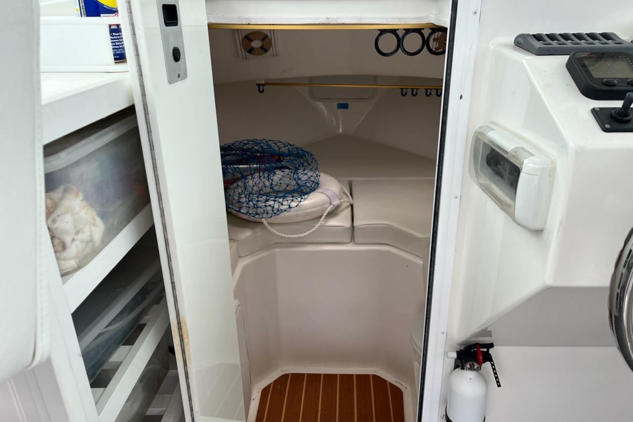 2012 Steiger Craft Miami cabin interior with storage and safety equipment.