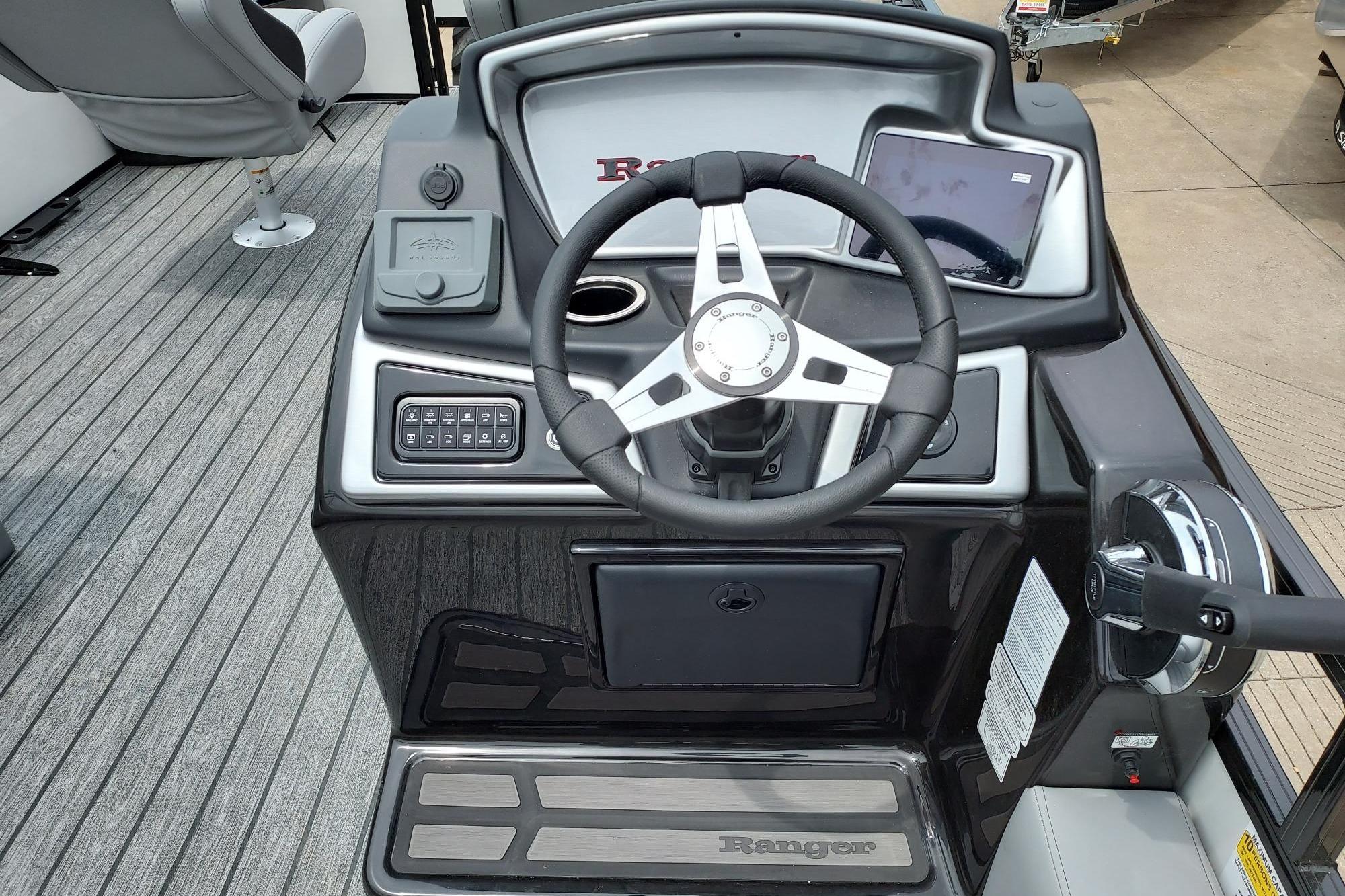 2026 Ranger 220F boat dashboard with steering wheel and control panel.