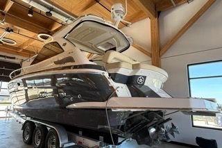 2019 Regal 35 Sport Coupe yacht in a showroom on a trailer.