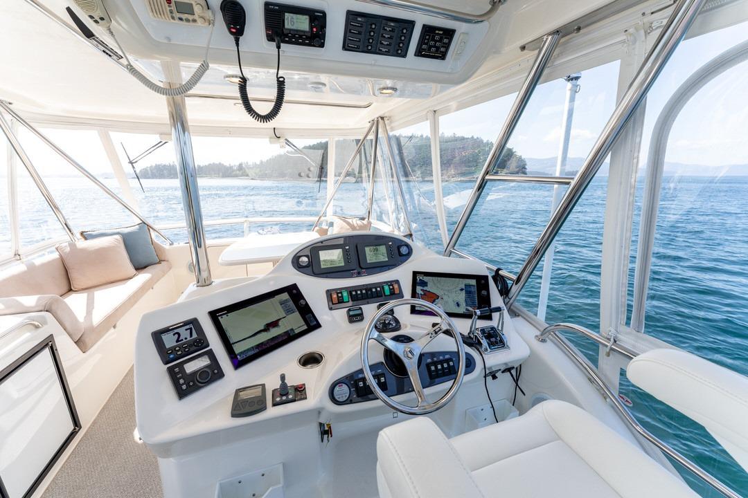 Luxurious 2006 Riviera 47 Open Flybridge Series II yacht interior with advanced navigation systems.