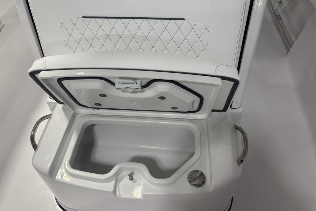 Open storage compartment on 2026 Sportsman Open 252 Center Console boat.
