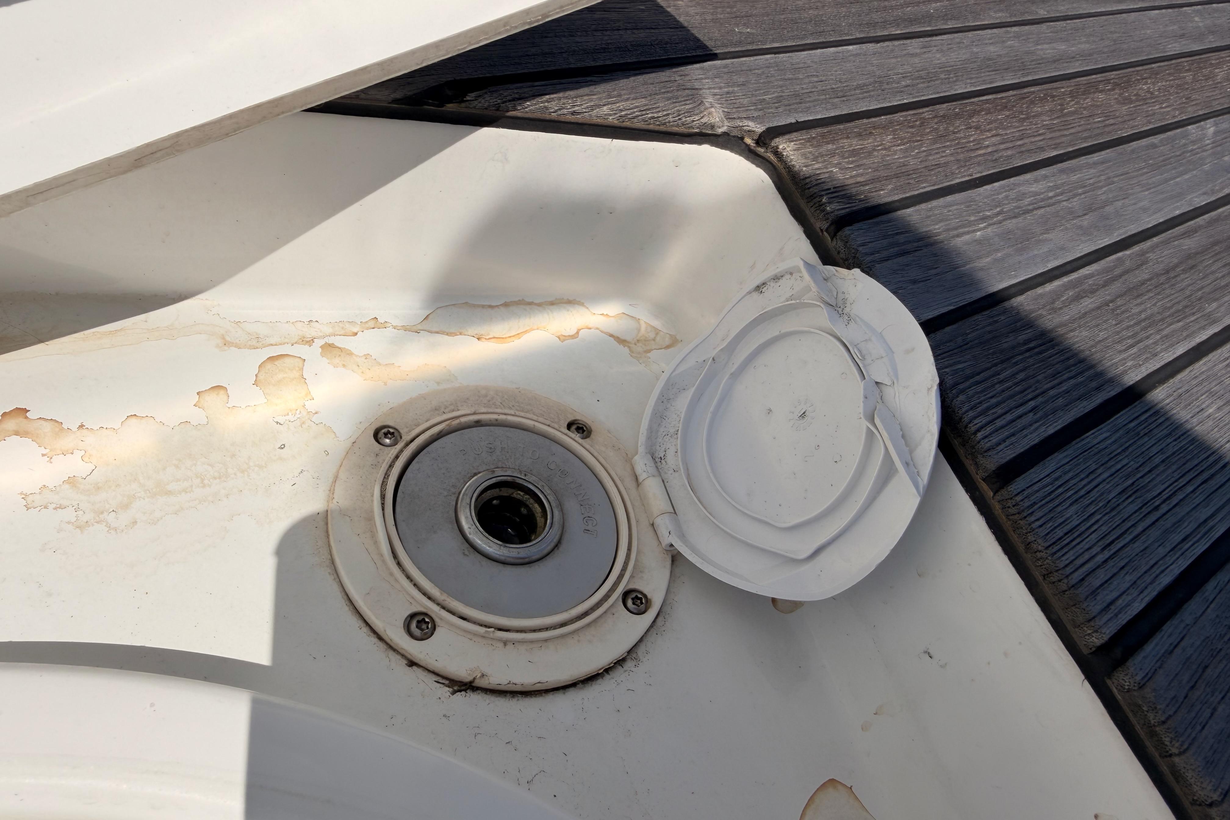 Deck detail of 2022 Beneteau Oceanis Yacht 54, showing a weathered hatch cover.