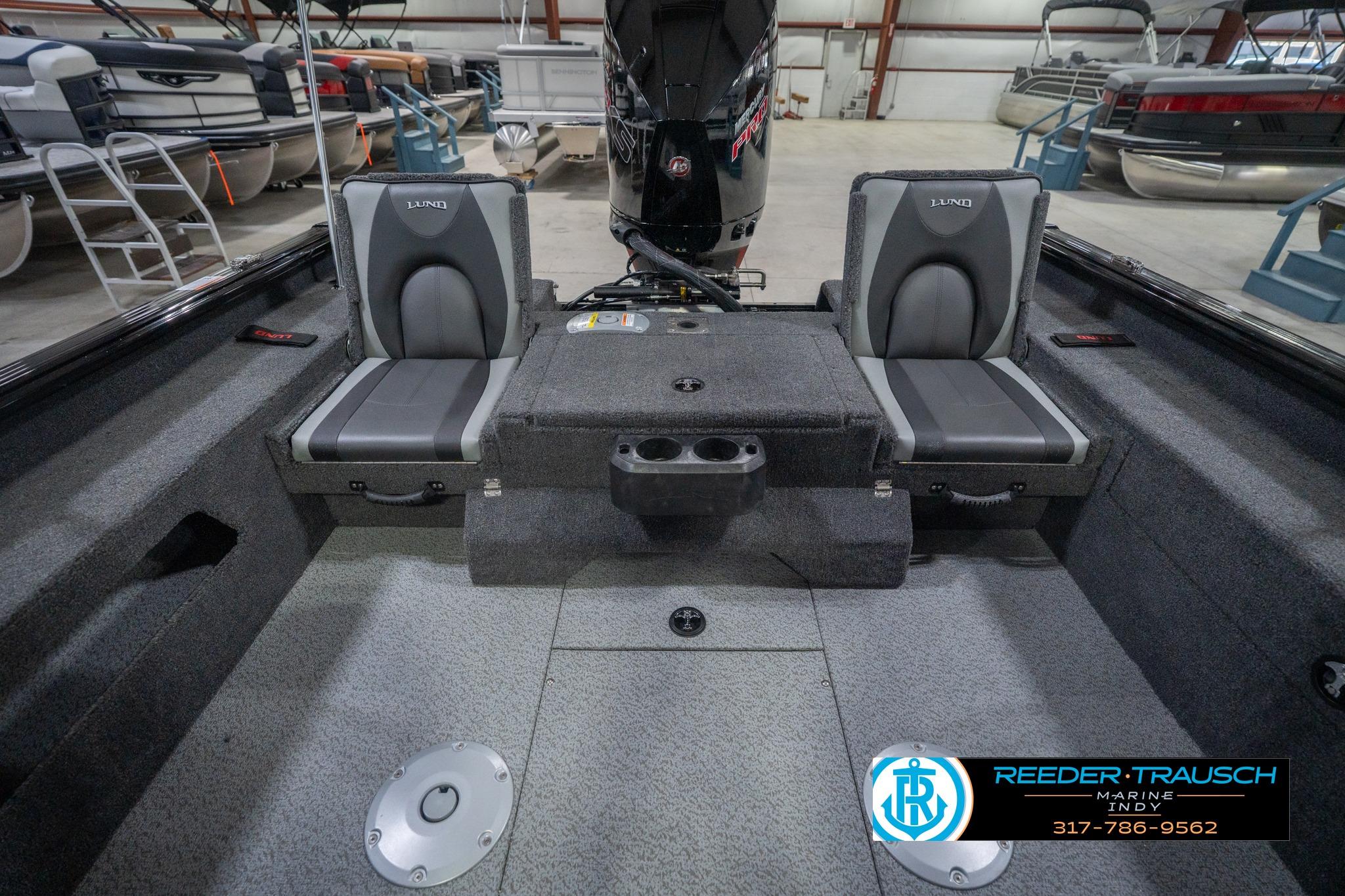 2026 Lund 2075 Impact XS boat interior with dual seats and storage compartments.