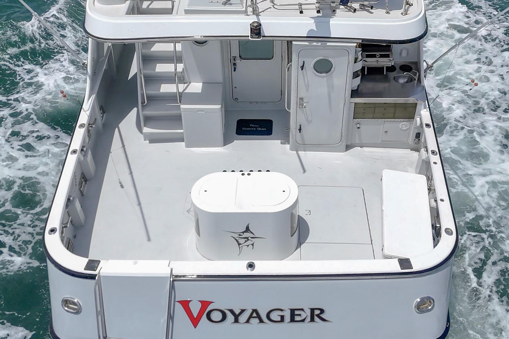 Seaton Long Range Cruiser 1990, named Voyager, cruising on open water with spacious deck.