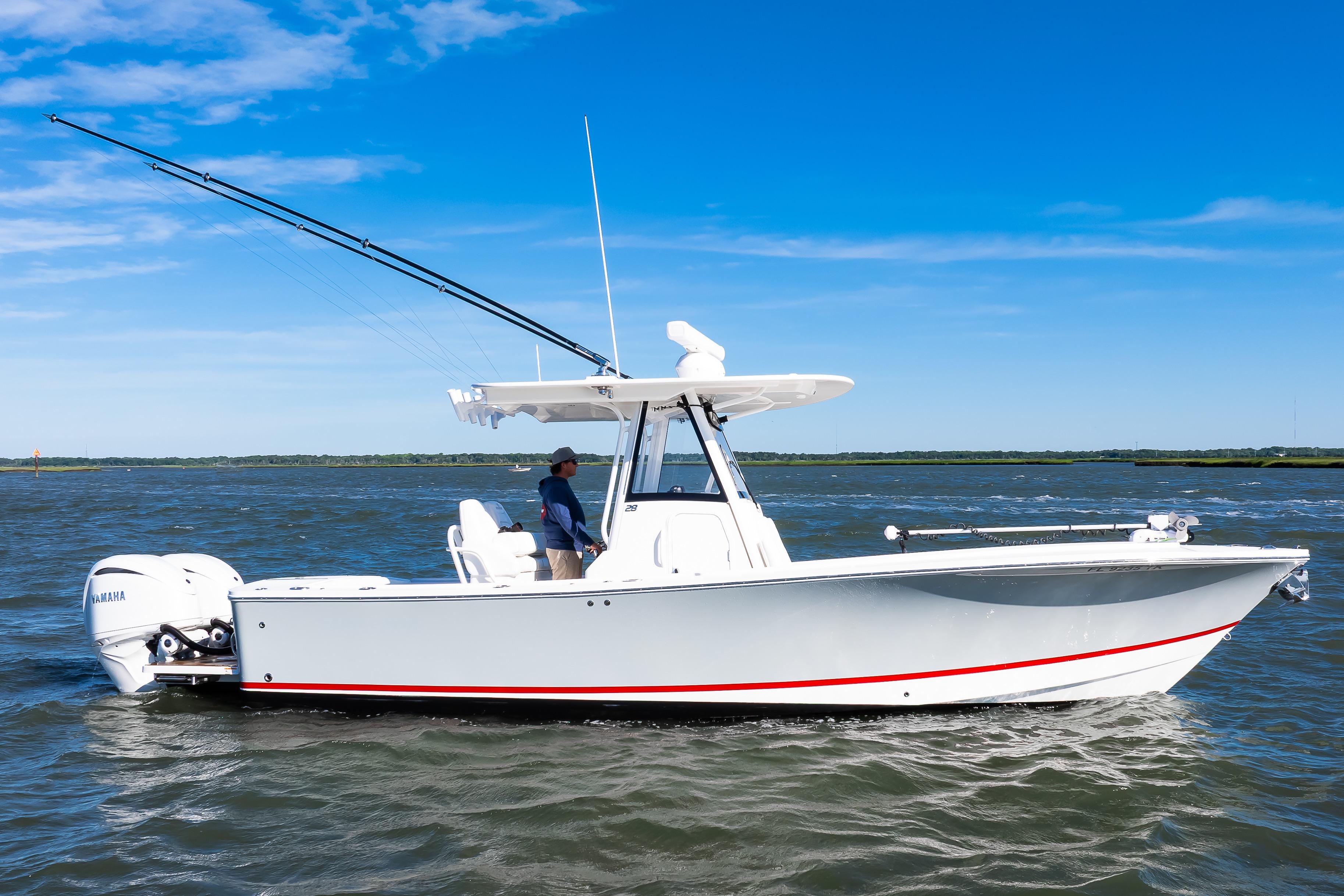 2022 Regulator 28 Forward Seating boat on open water, featuring dual Yamaha engines.