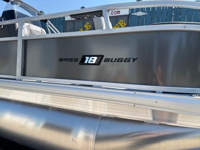 2026 Sun Tracker Bass Buggy 18 DLX pontoon boat side view with logo.