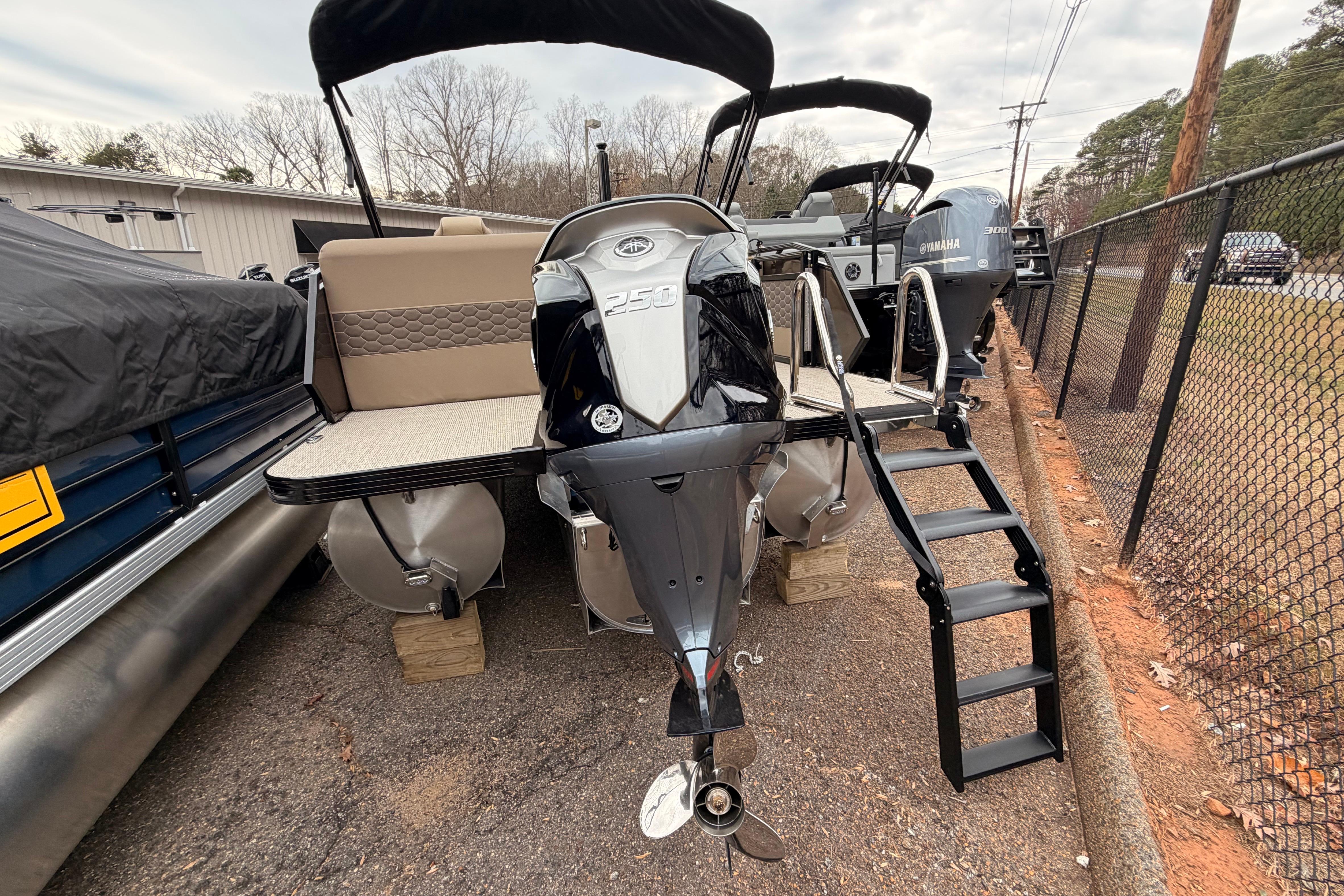 2026 Veranda VR 235 L pontoon boat with Yamaha 250 engine, docked with ladder.