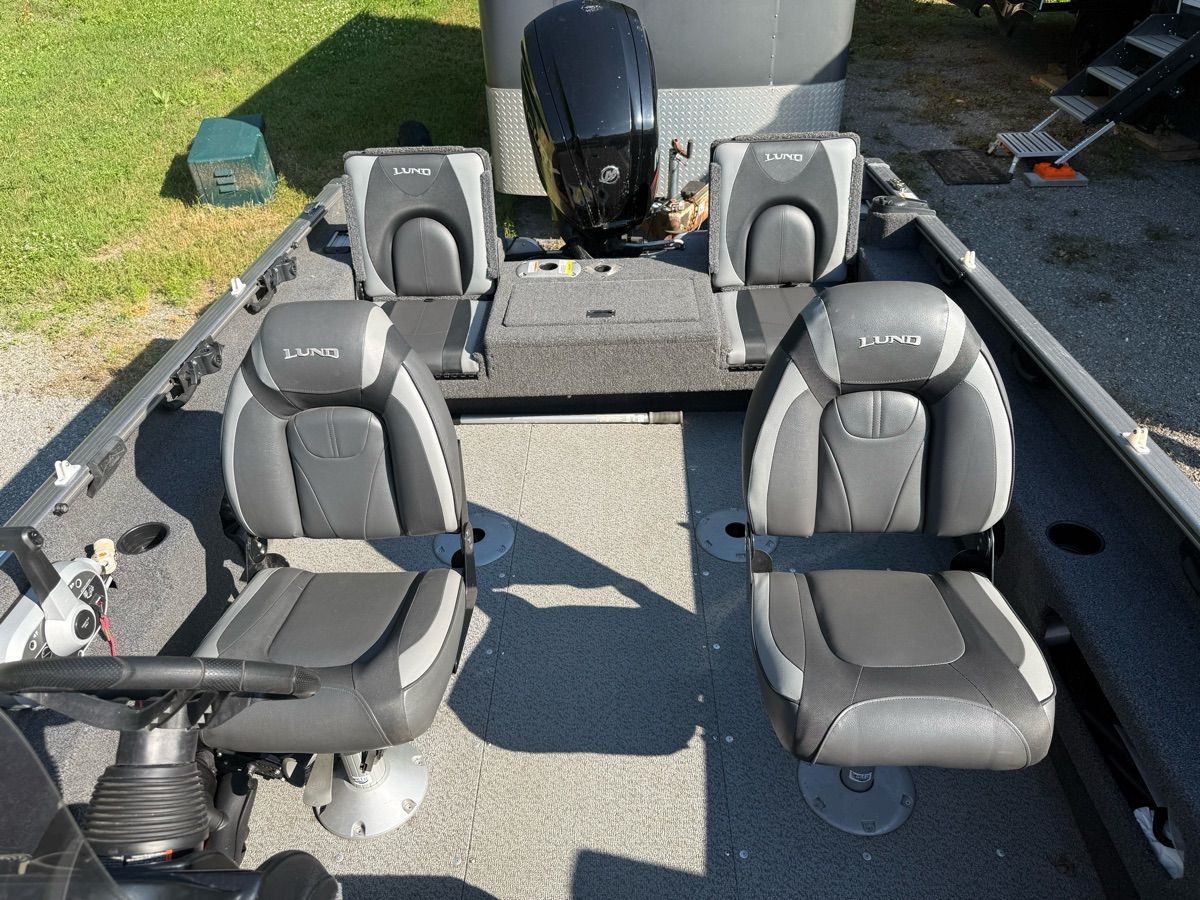 The image shows the interior of a 2019 Lund 1775 Adventure SS boat with four cushioned seats.