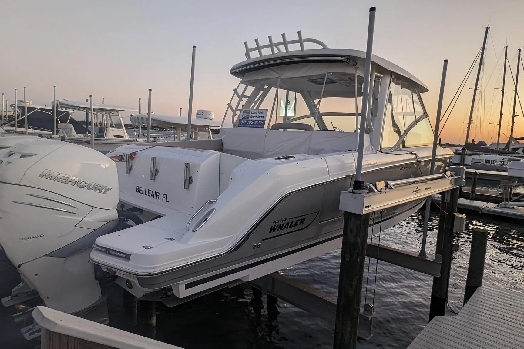 2017 Boston Whaler 320 Vantage docked at sunset, featuring Mercury engines.