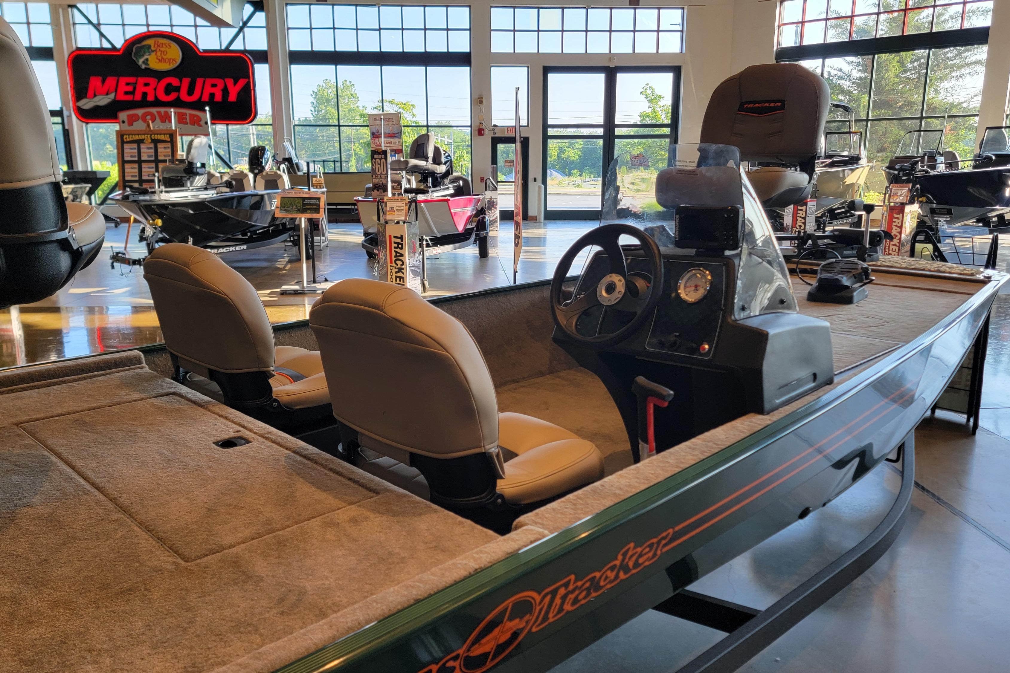 2026 Tracker Bass Tracker Classic Limited boat displayed in showroom with Mercury signage.