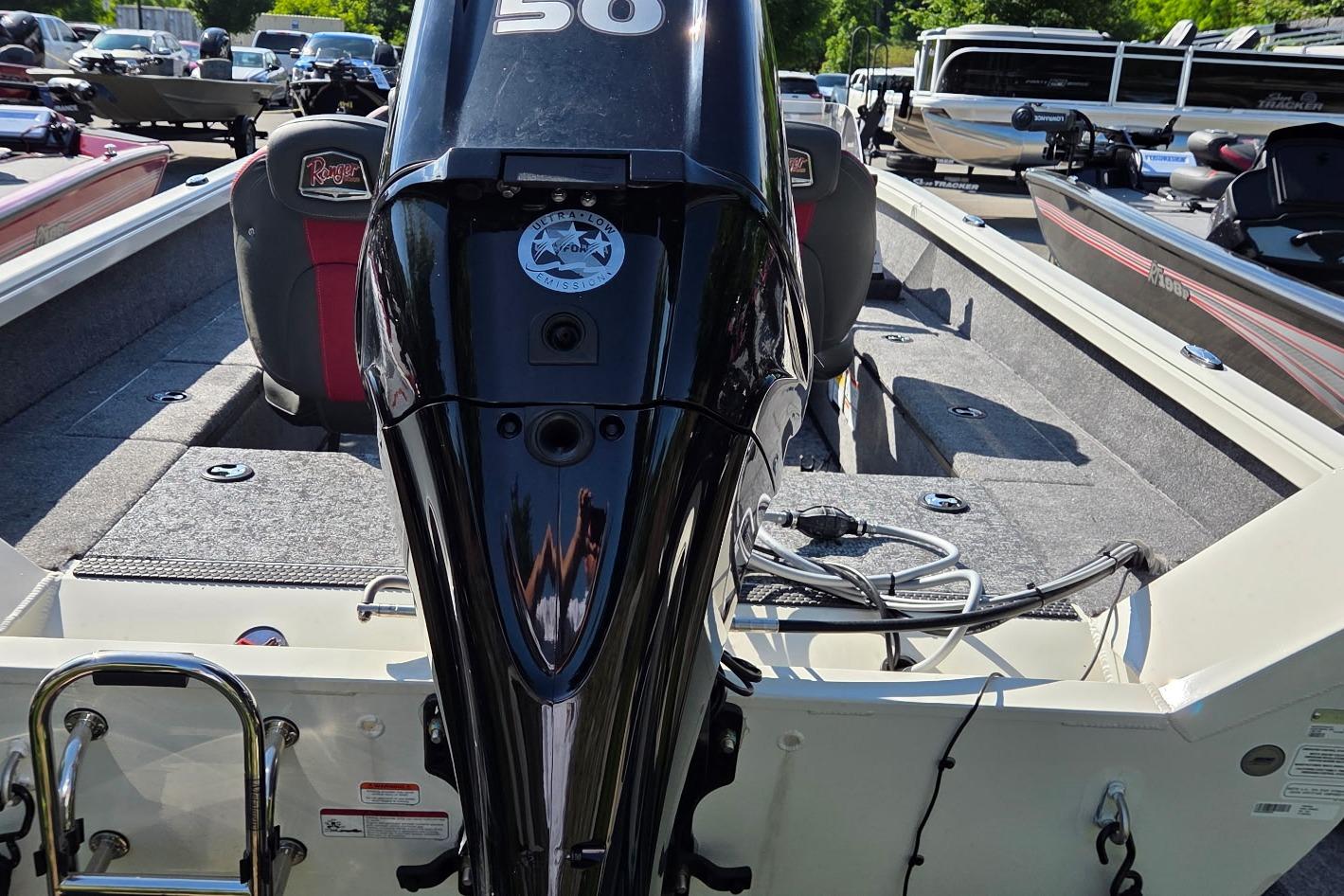 2026 Ranger VS1665SC boat with outboard motor, parked among other boats.