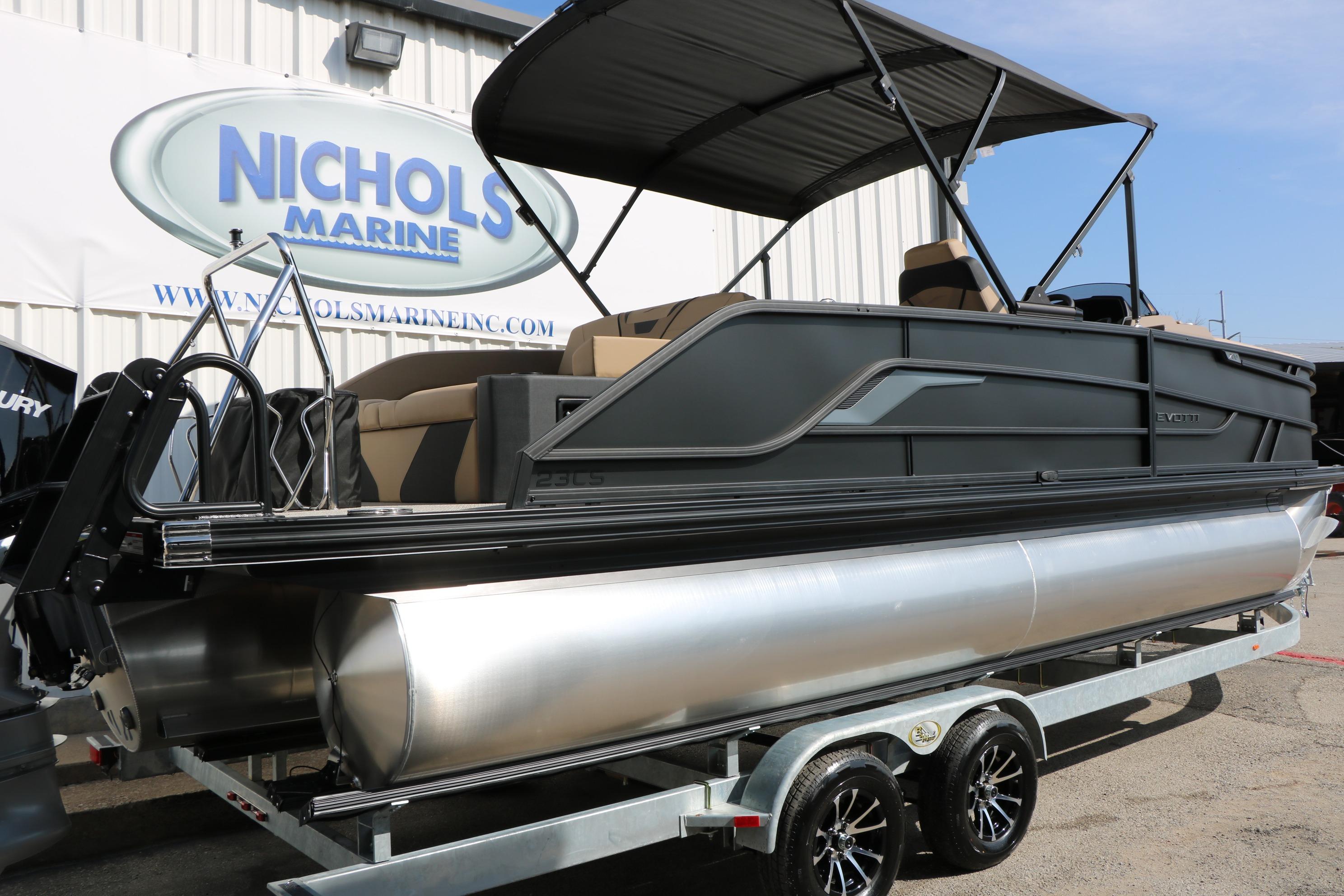 2026 Evotti 723CS pontoon boat on trailer at Nichols Marine dealership.