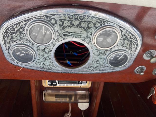 Dashboard of a 2000 Grand Craft Classic Runabout with vintage gauges and intricate design.