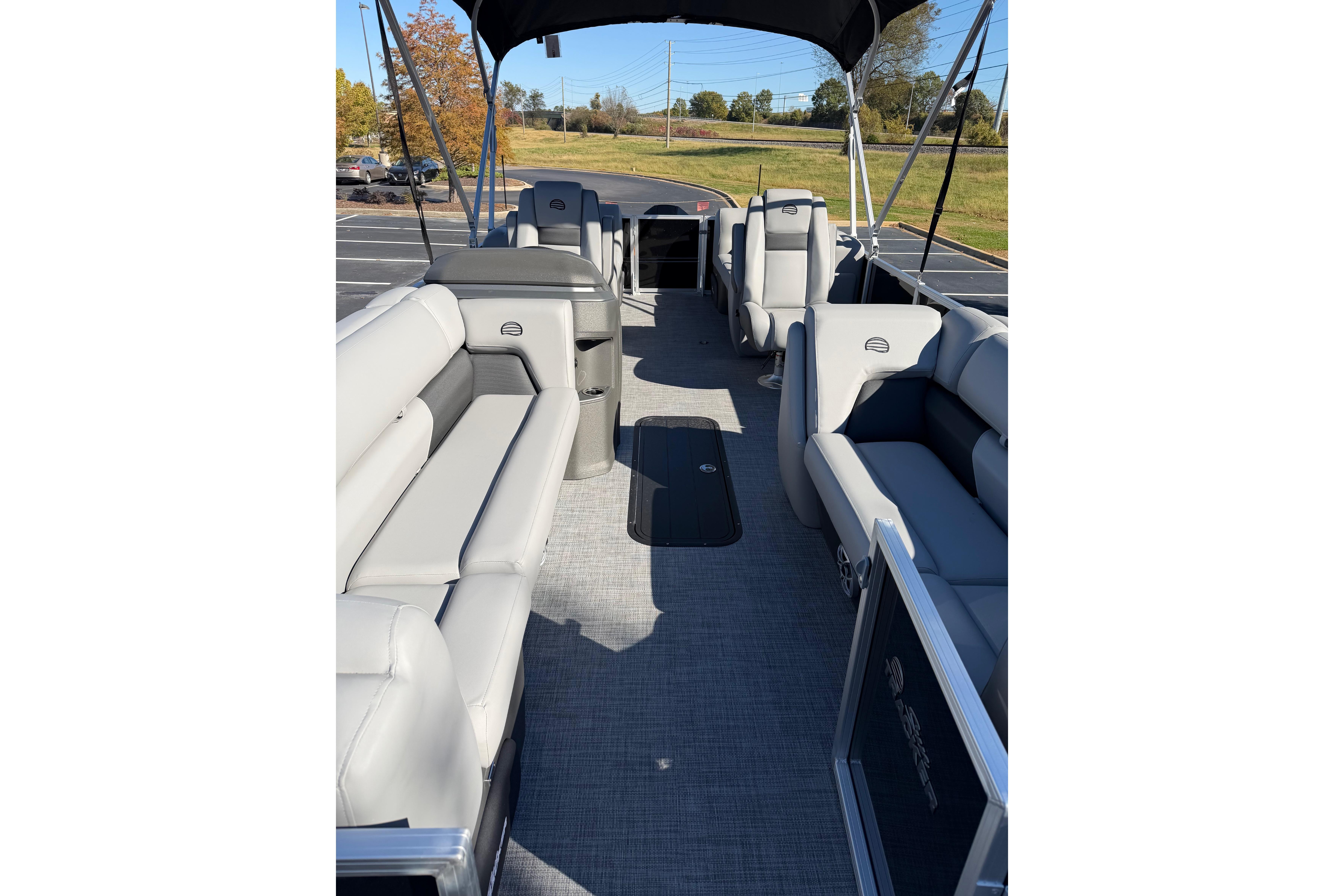 2026 Sun Tracker Party Barge 22 XP3 interior with spacious seating and canopy.