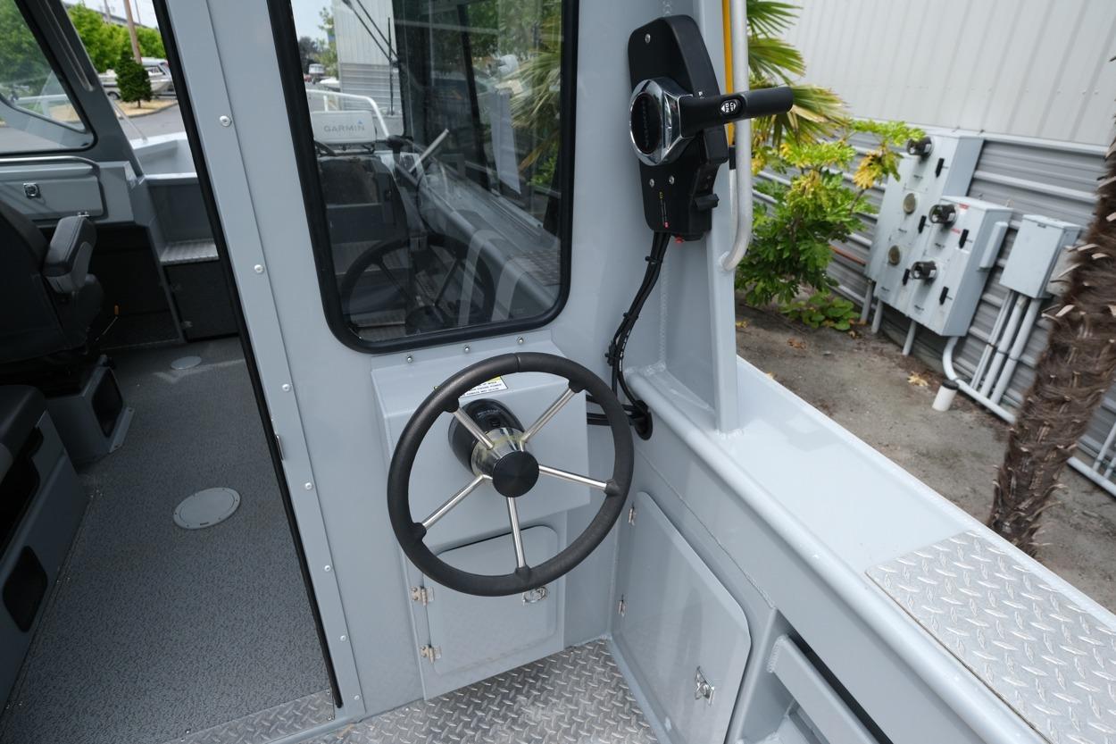 2021 Hewescraft 240 Ocean Pro ET Hardtop boat interior with steering wheel and controls.