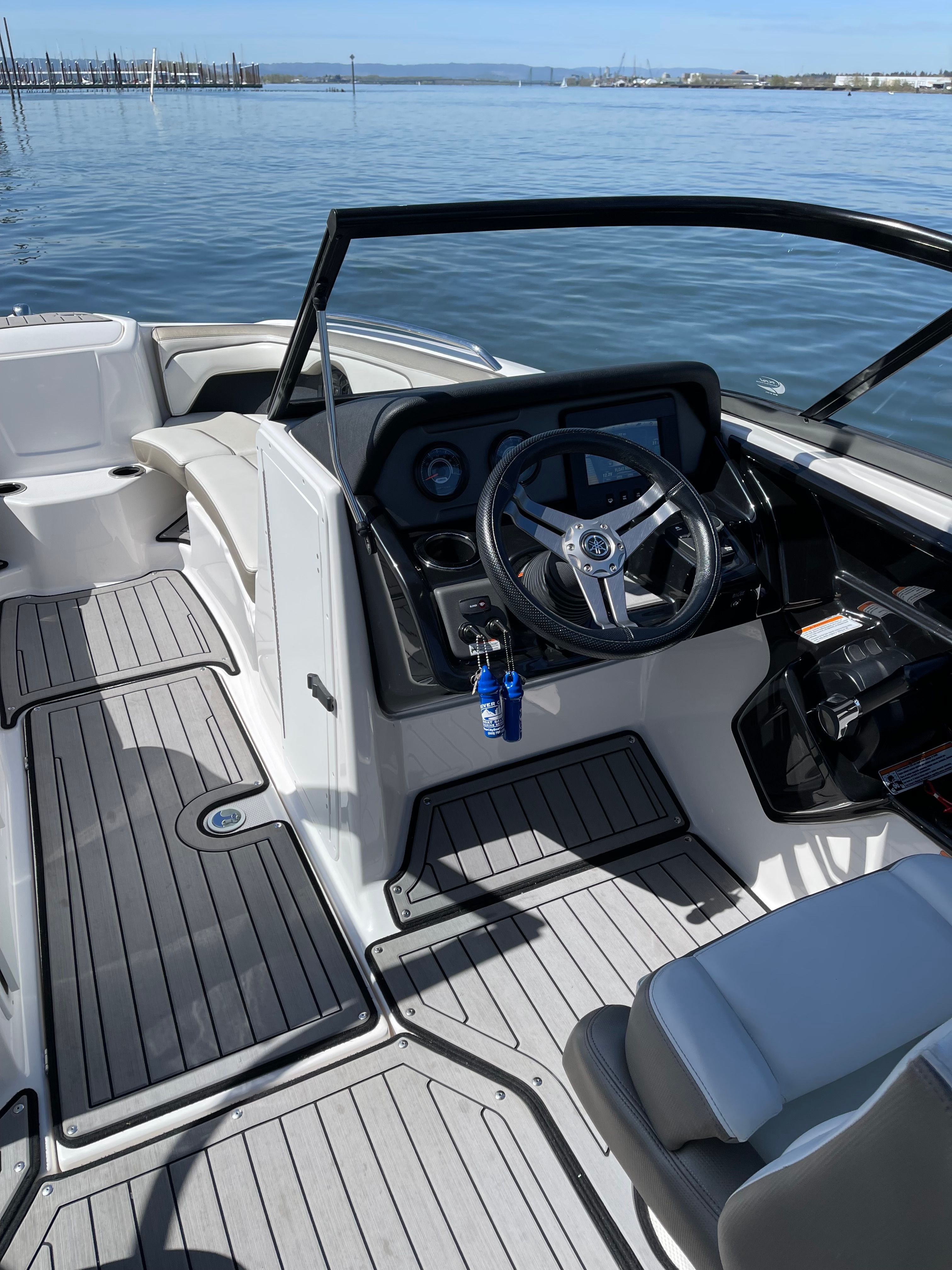 The image shows the cockpit of a 2018 Yamaha 212 Limited S boat with a modern helm.
