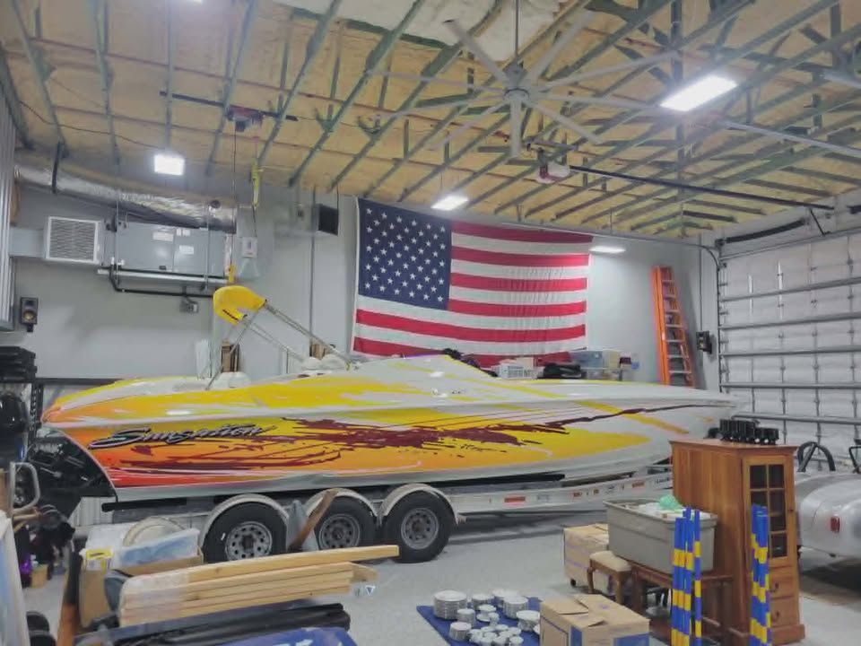 2003 Sunsation 32 Dominator in a garage with US flag.