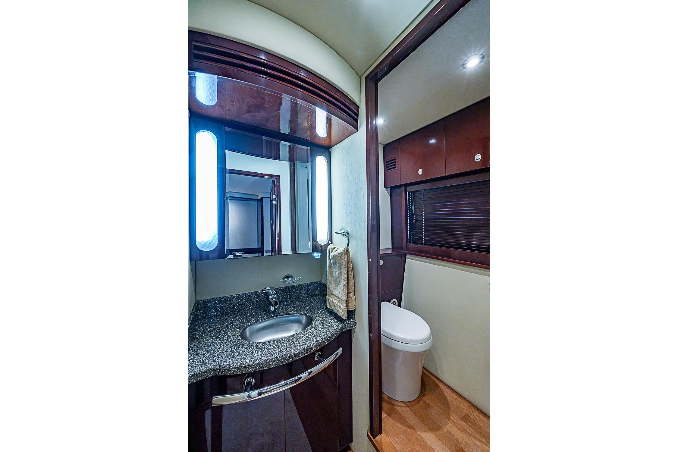 Luxurious bathroom interior of 2008 Sea Ray 60 Sundancer yacht with modern fixtures.