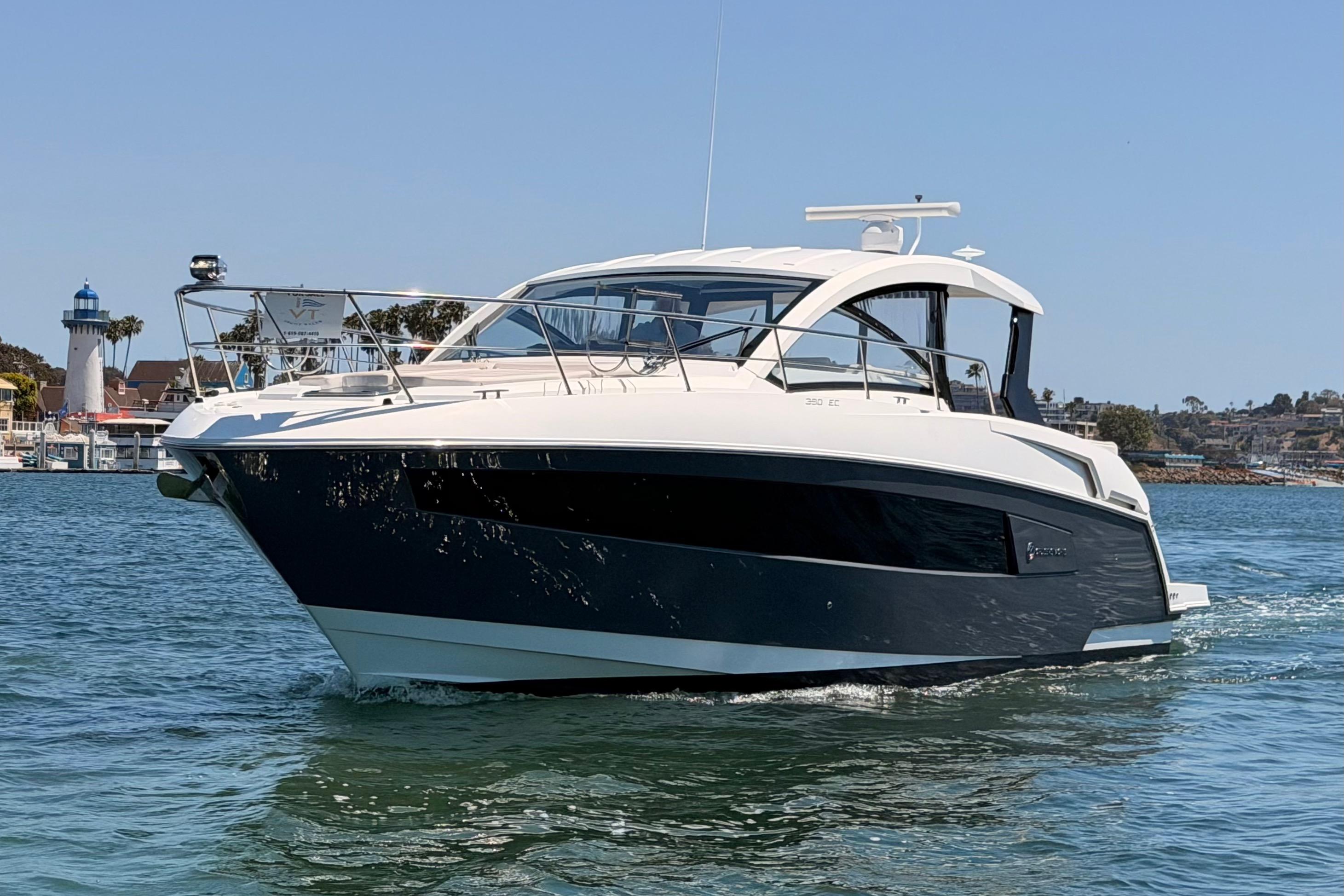 2020 Cruisers Yachts 390 Express Coupe on water near lighthouse.