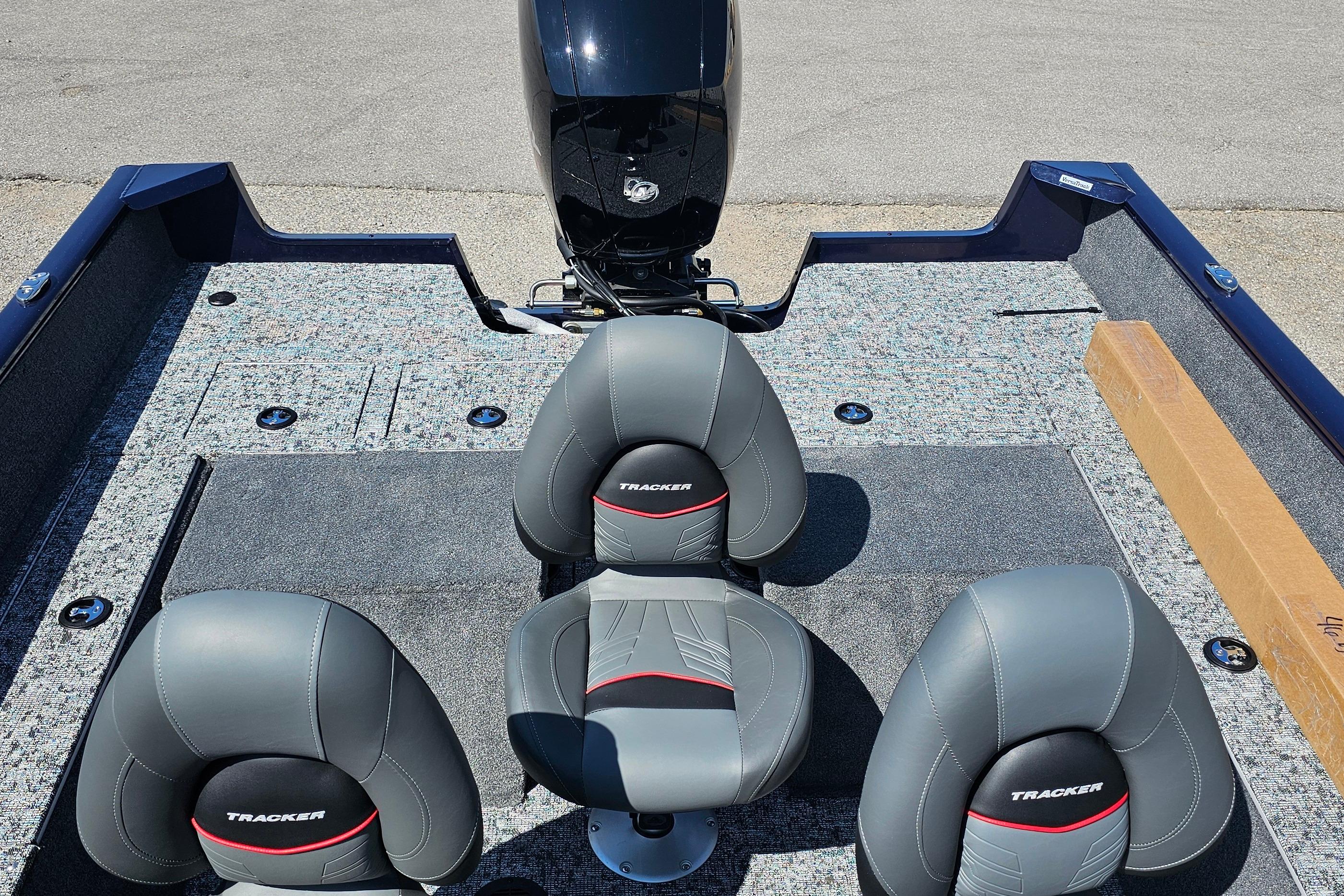 2026 Tracker Pro Guide V-175 Combo boat interior with three gray seats and motor.