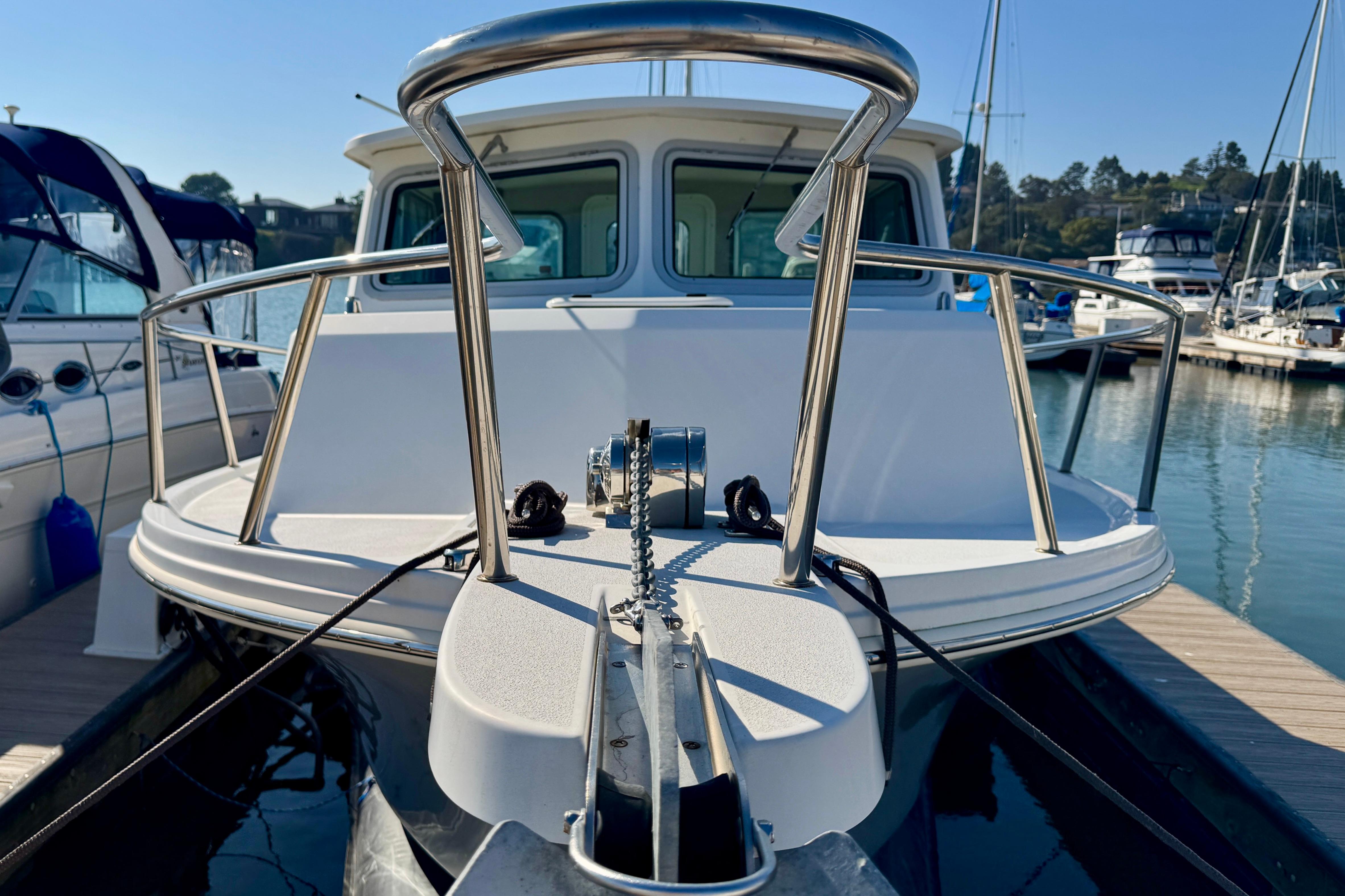 2021 Parker 2820 XLD Sport Cabin boat docked at marina, front view.