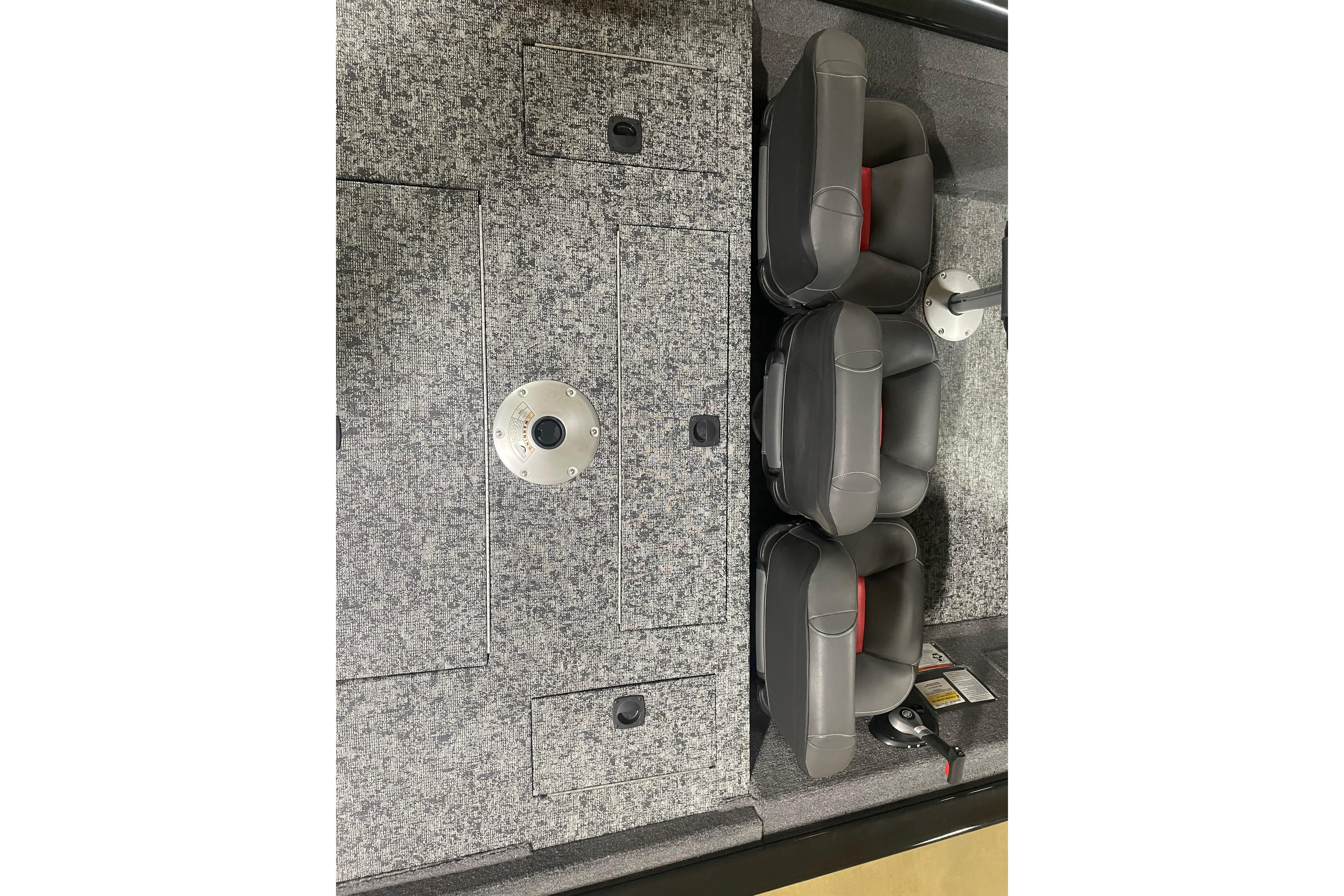2026 Tracker Pro Team 175 Crappie Edition boat interior with gray seating and storage compartments.