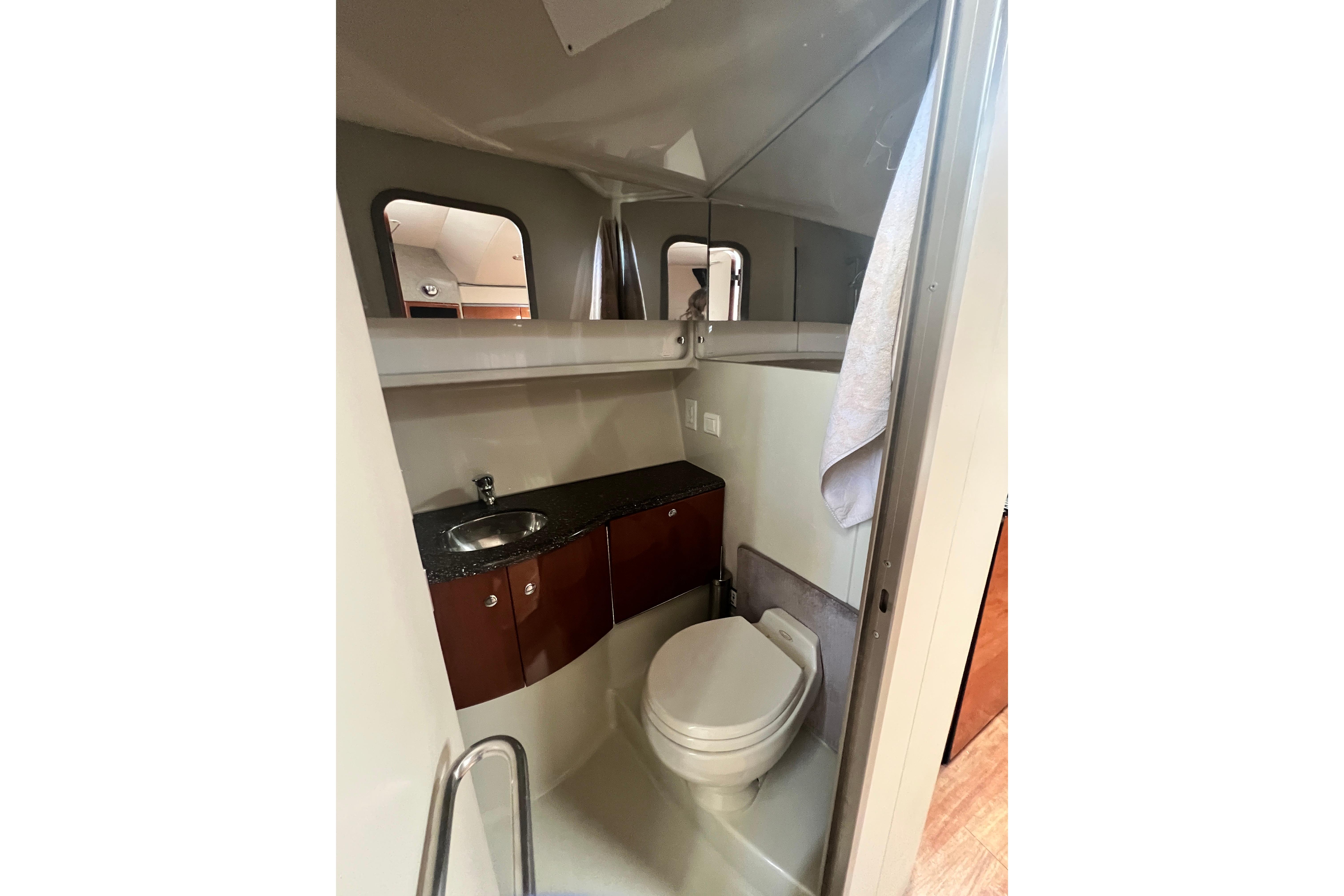 Bathroom interior of 2006 Formula 40 Performance Cruiser with sink and toilet.