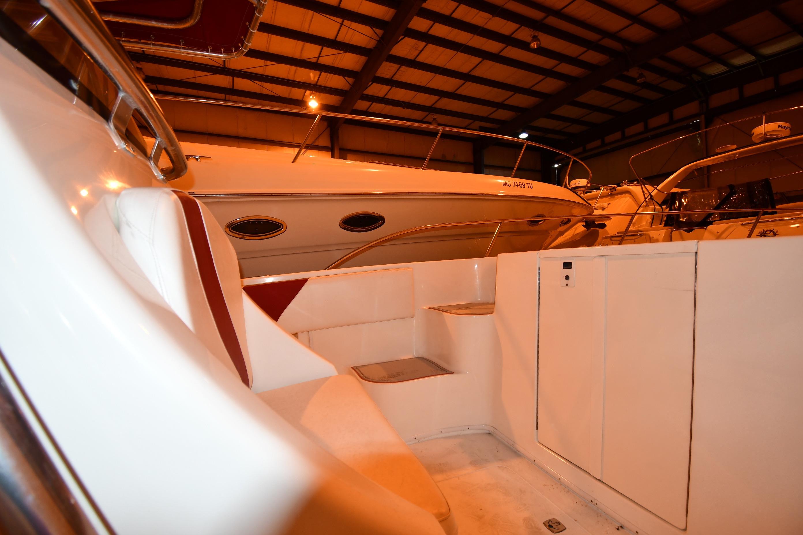 2001 Fountain 38 Center Console boat interior in a dimly lit storage facility.