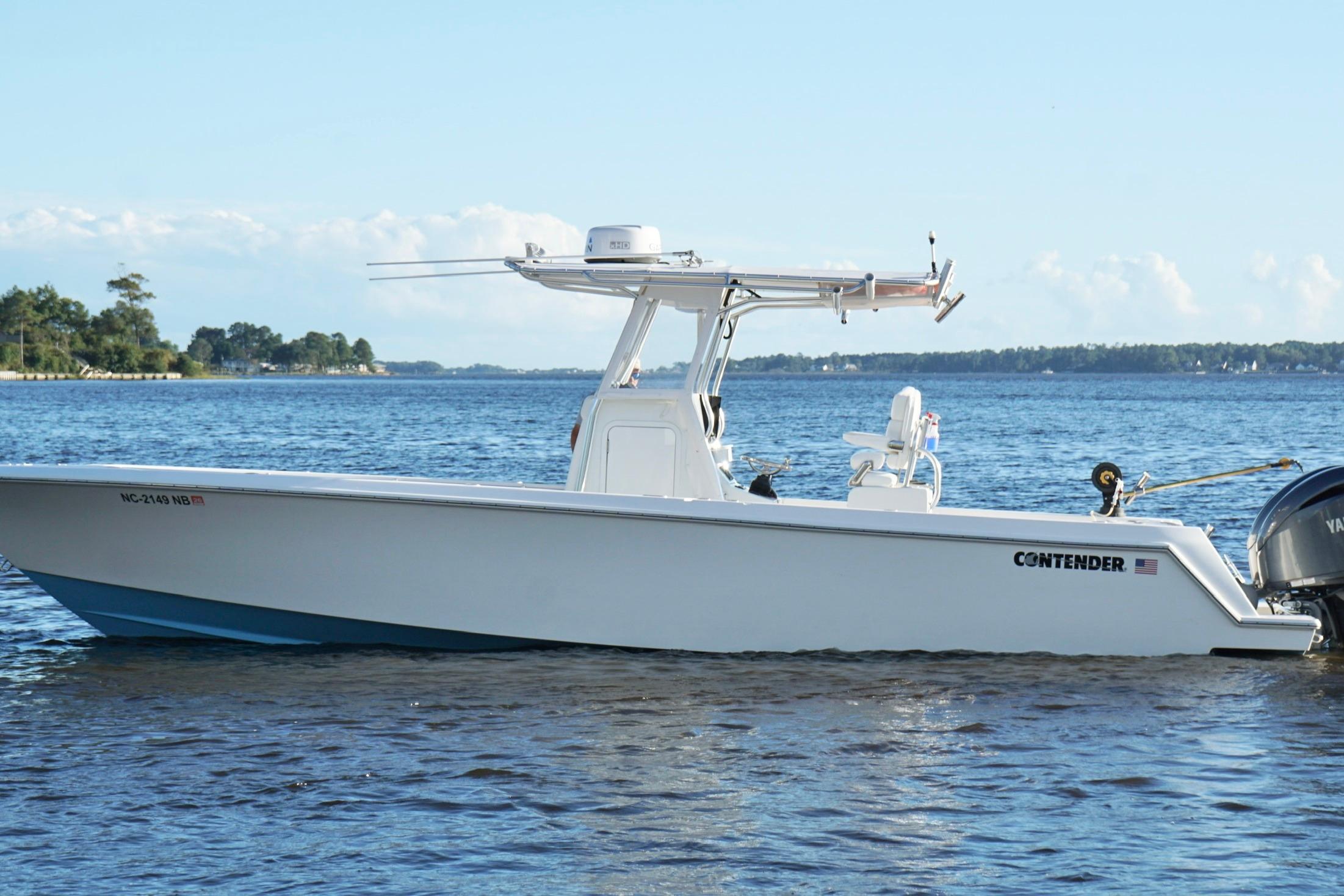 2023 Contender 30 Tournament boat on calm water, side view.