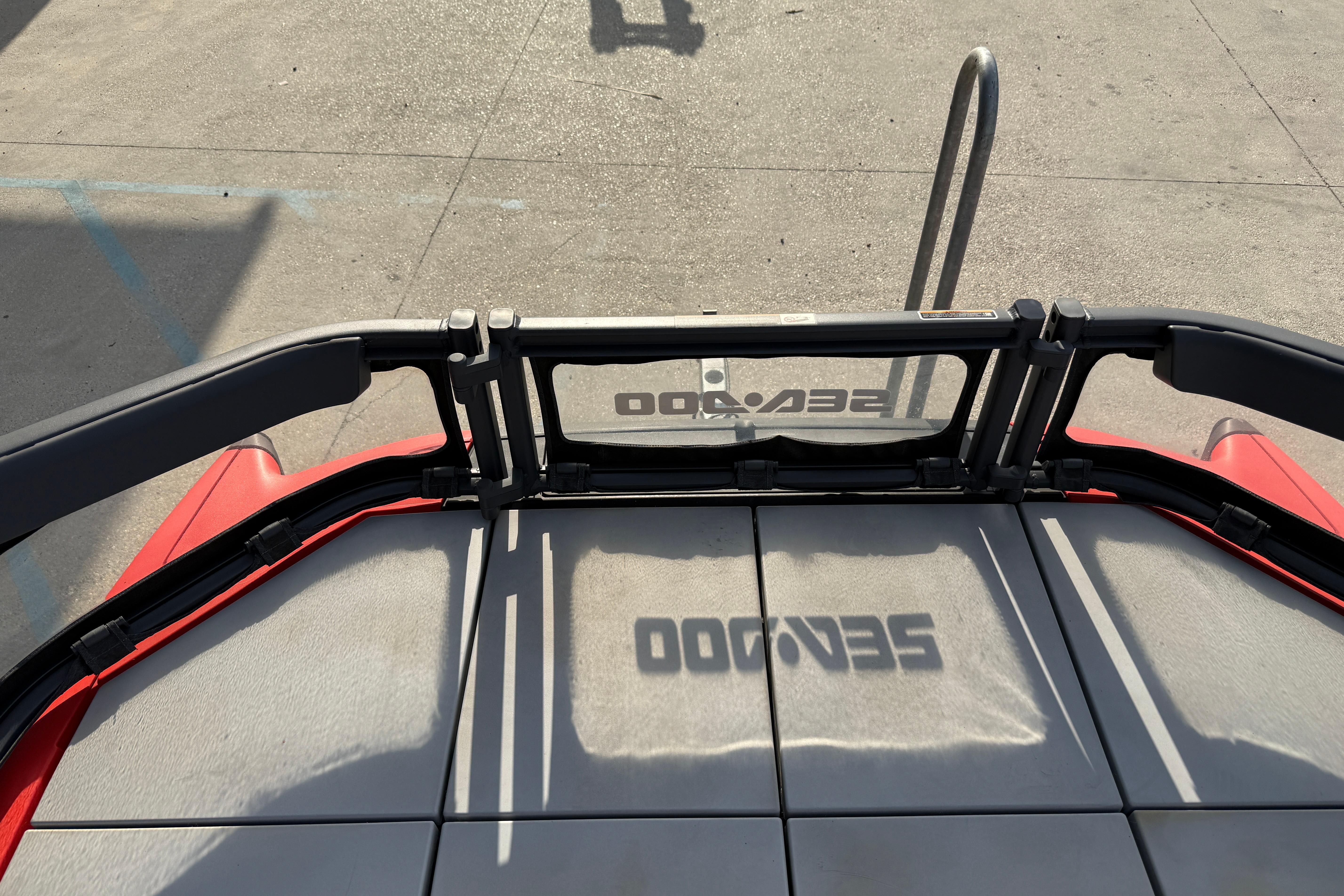 2023 Sea-Doo Switch Sport 18 deck with logo shadow on textured surface.