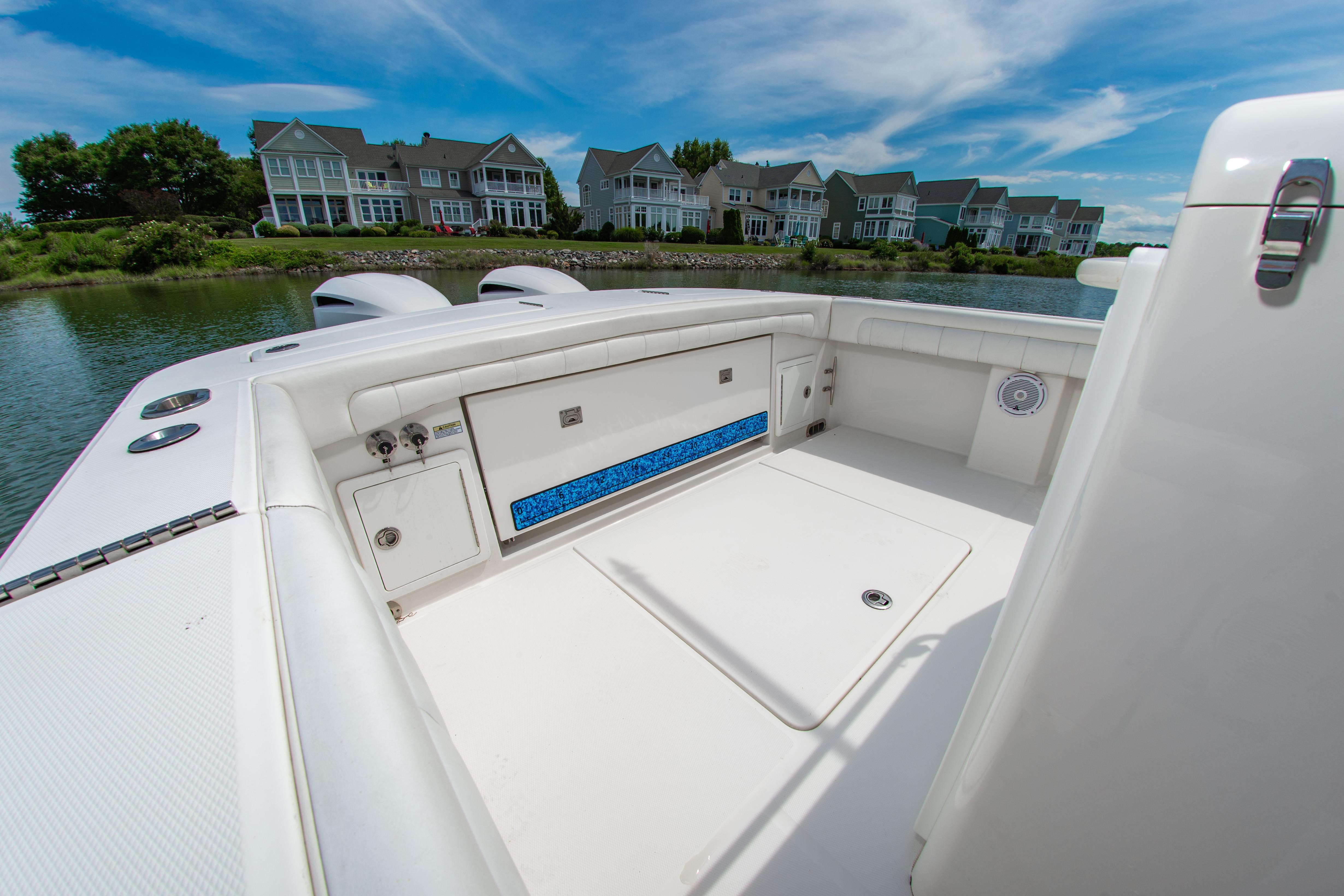 2019 Regulator 31 boat interior with waterfront homes in the background.