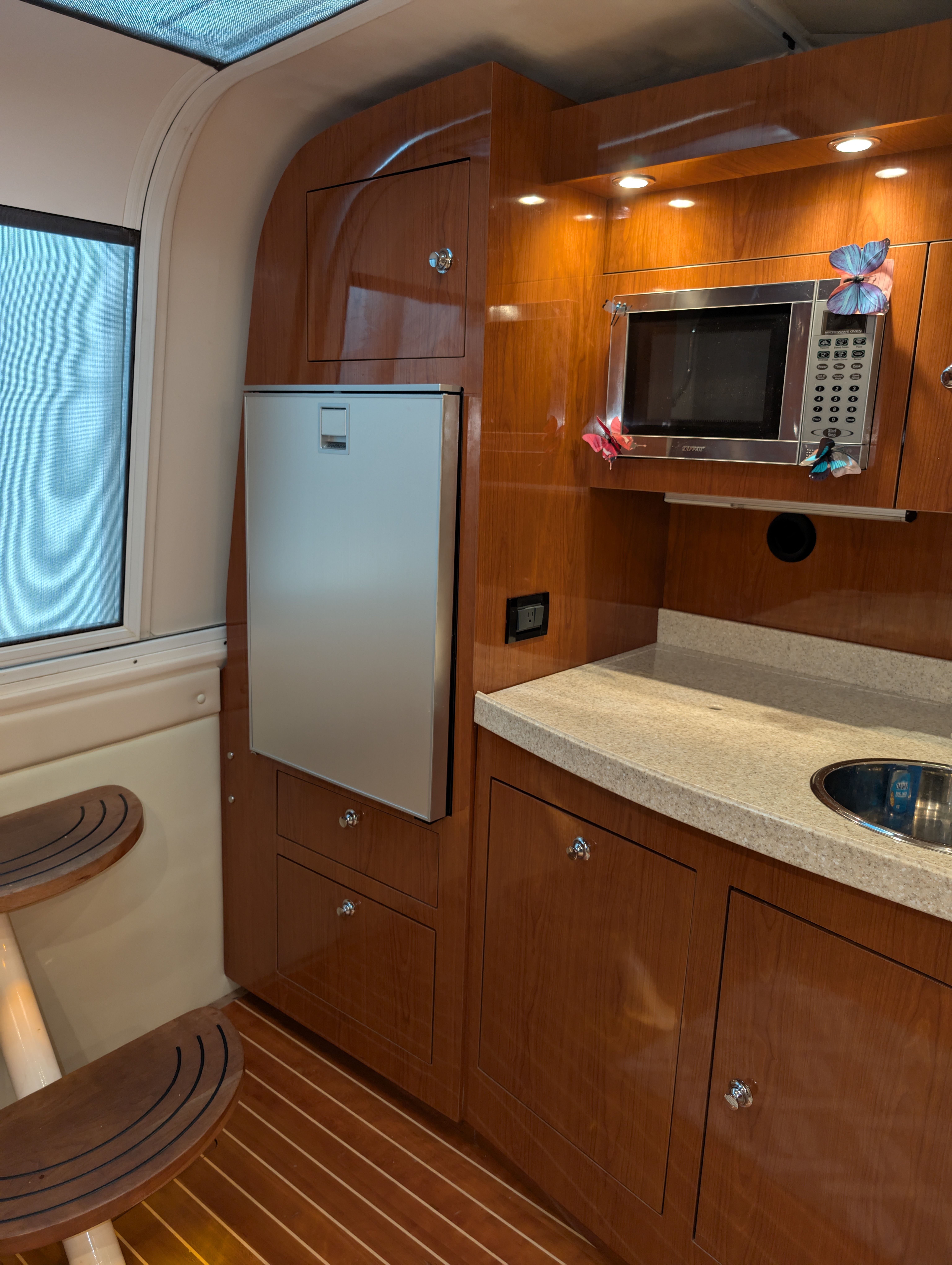 Interior of a Regal Commodore 3560 yacht with kitchenette.