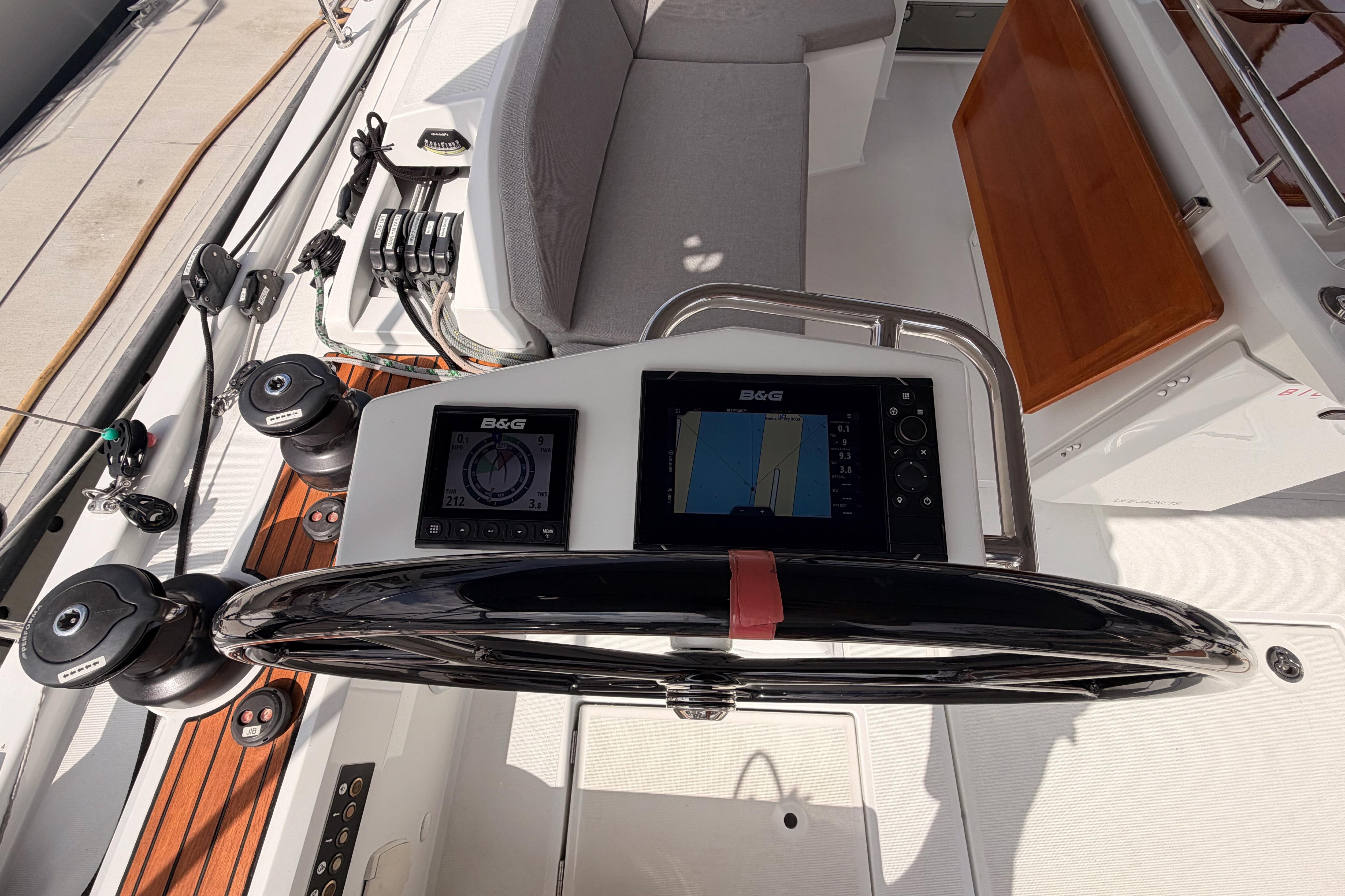 Cockpit of 2020 Beneteau Oceanis 46.1 with navigation instruments and steering wheel.