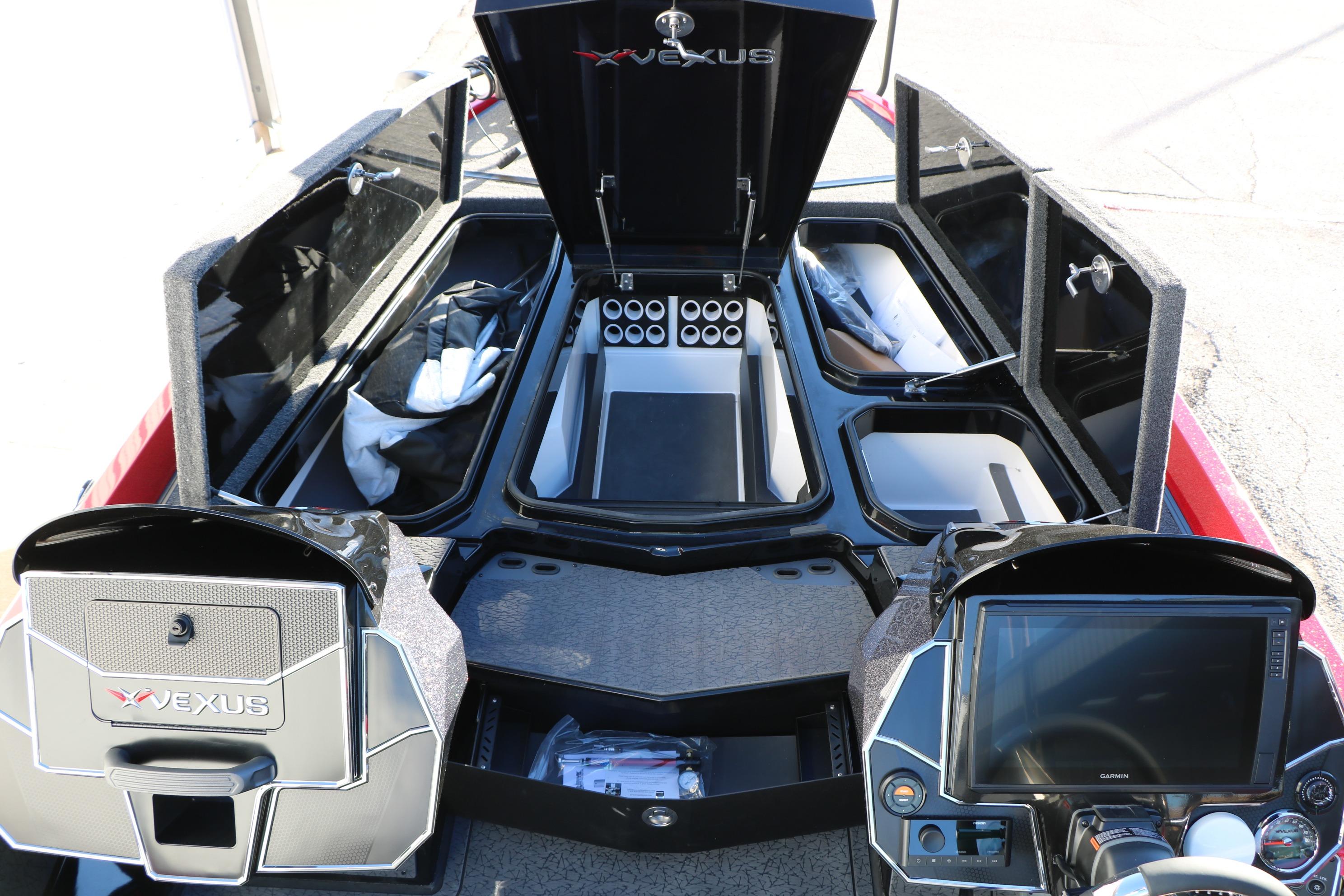 2026 Vexus VXs21 boat interior with open storage compartments and advanced control panels.