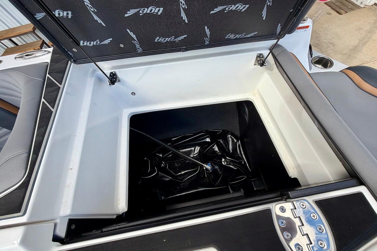 Storage compartment of 2025 Tigé Ultré 25ZX boat, featuring sleek interior design.