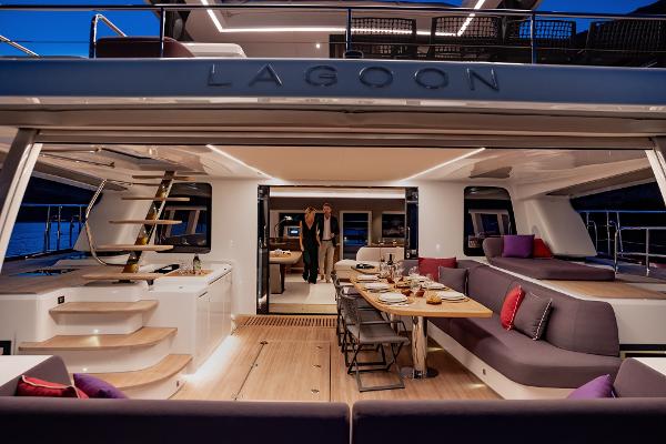 Luxurious 2025 Lagoon SIXTY 7 yacht interior with elegant dining area and modern design.