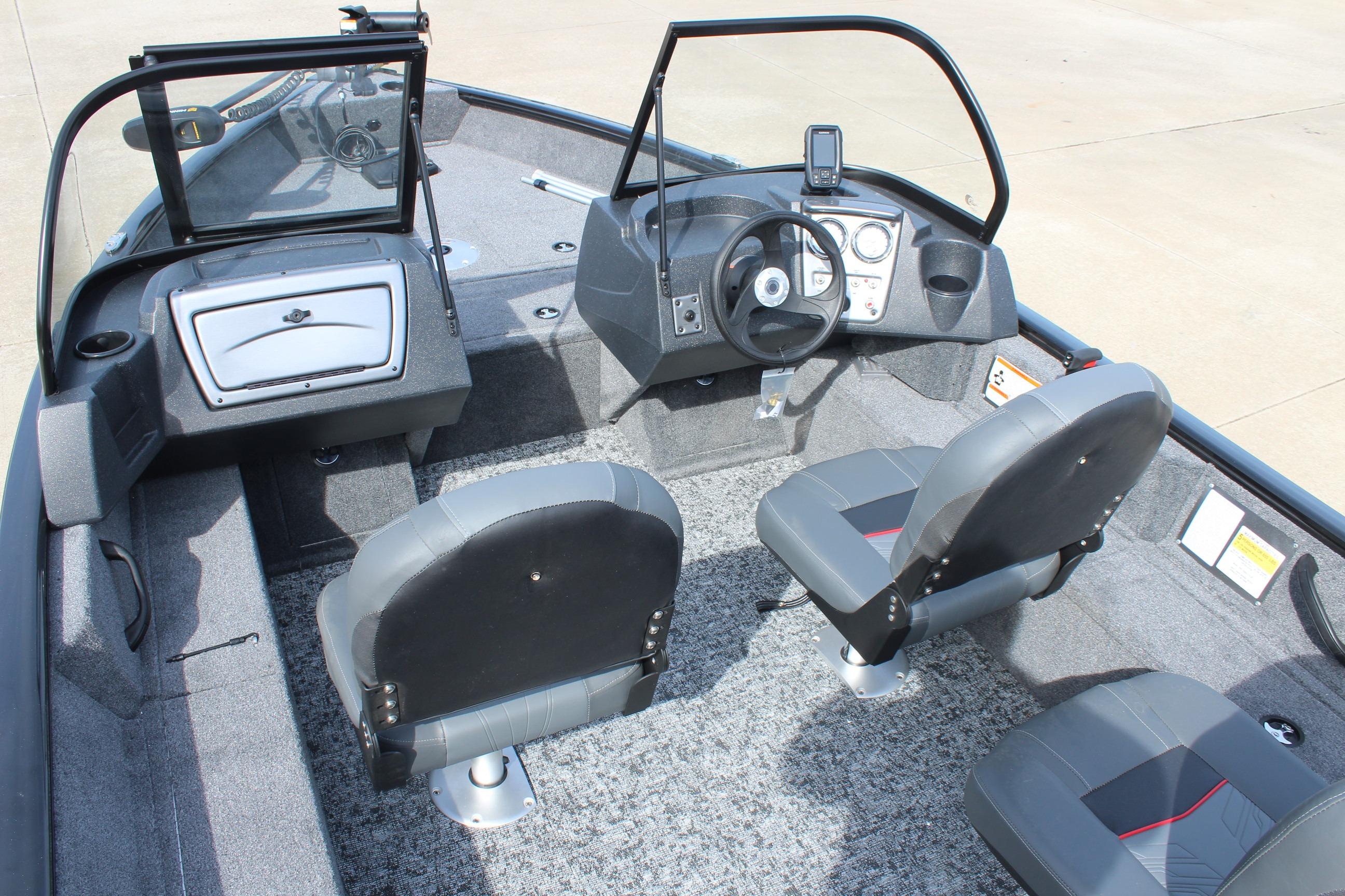 Interior of 2026 Tracker Pro Guide V-16 WT boat with steering console and seating.